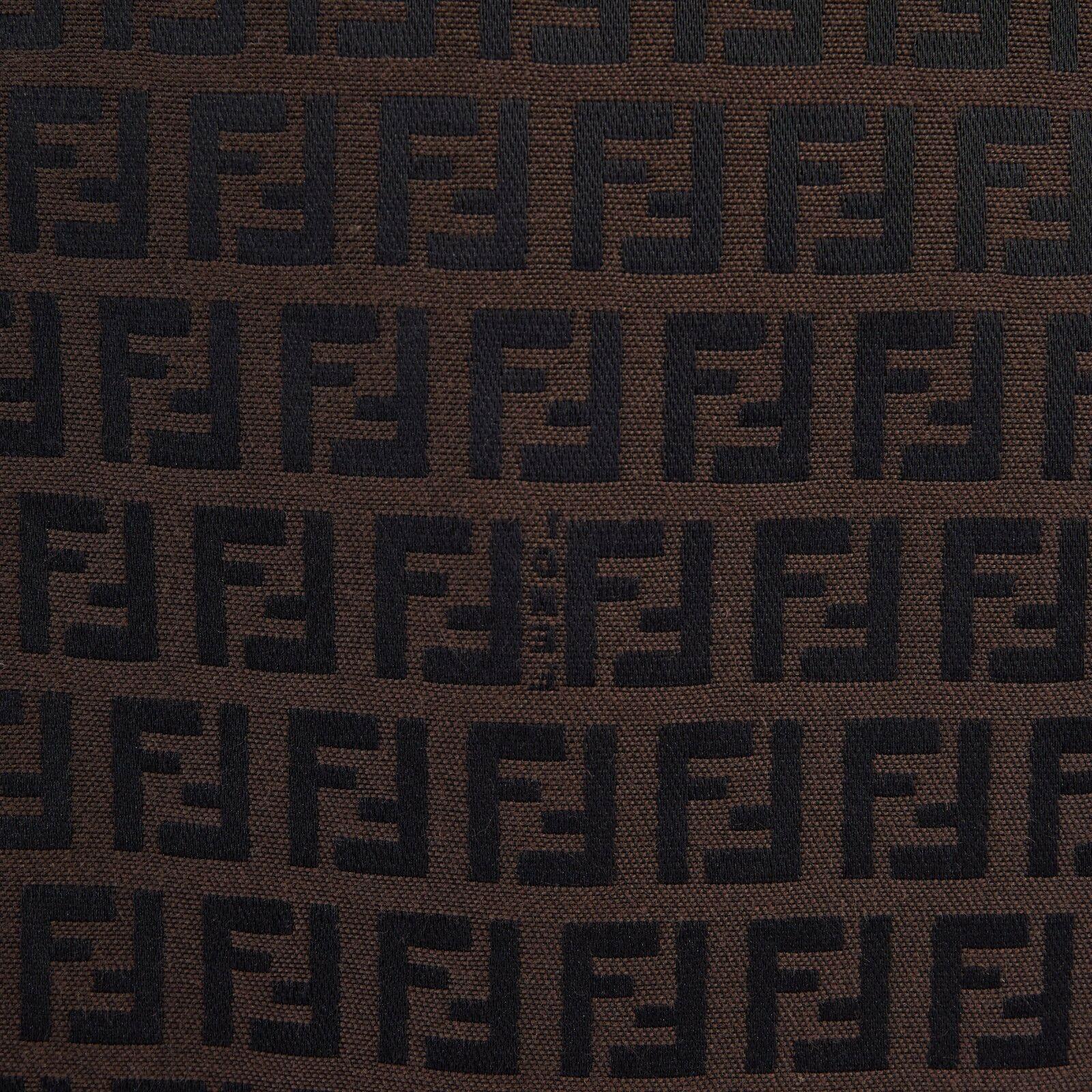 FENDI brown FF monogram jacquard slit back knee length pencil skirt IT40
Brand: Fendi
Designer: Karl Lagerfeld
Model Name / Style: Monogram skirt
Material: Polyester, cotton
Color: Brown
Pattern: Other
Closure: Zip
Extra Detail: Mid rise.
Made in: