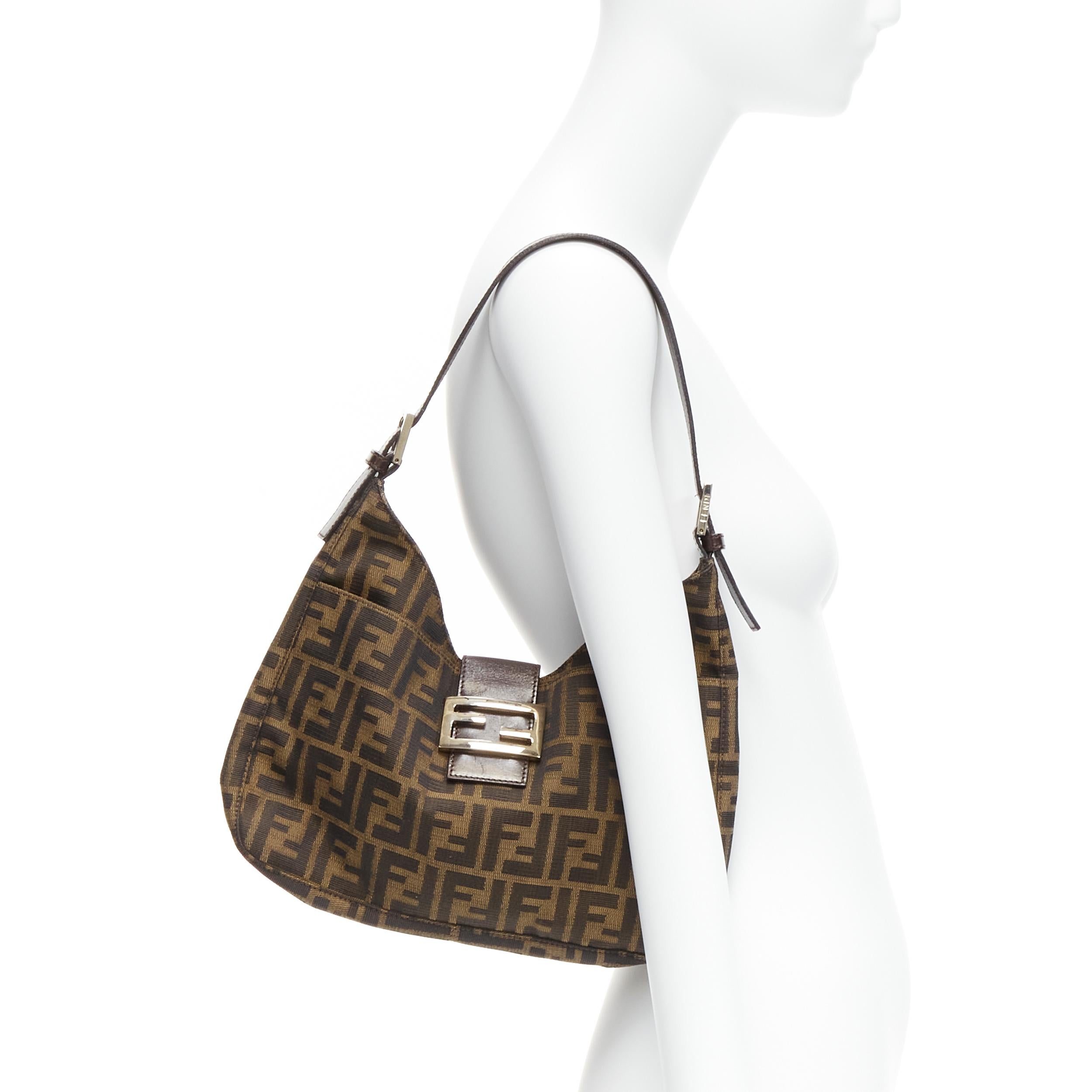 FENDI brown FF Zucca monogram silver buckle top handle underarm hobo bag
Reference: TGAS/C02039
Brand: Fendi
Material: Fabric, Leather, Metal
Color: Brown
Pattern: Monogram
Closure: Snap Buttons
Lining: Brown Fabric
Made in: