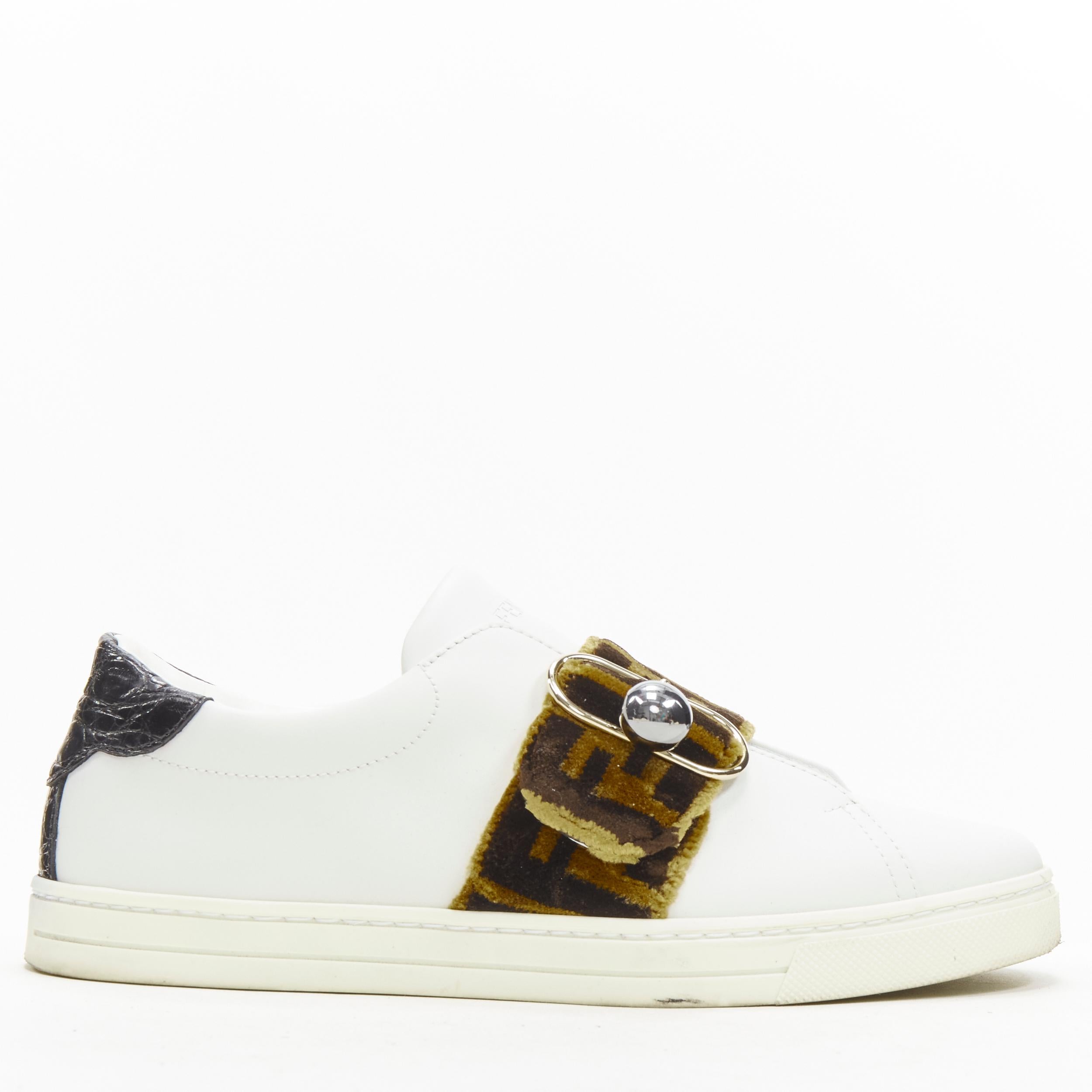 FENDI brown FF Zucca monogram velvet strap white leather sneaker EU36 
Reference: ANWU/A00346 
Brand: Fendi 
Material: Leather 
Color: White 
Pattern: Solid 
Closure: Stretch 
Extra Detail: Stretch gusset FF velvet band with mixed metal buckle