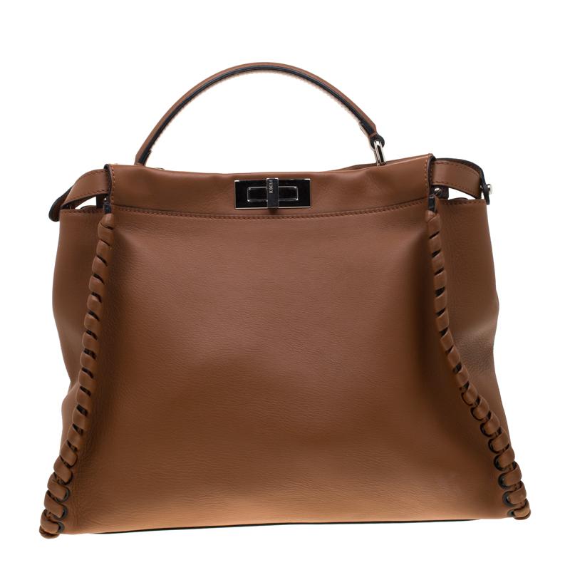 One of the most popular bags from the house of Fendi, the Peekaboo has been a glorious member of the It bags club since its very inception. Reasons? The bag is both trendy as well as elegant, it designed spaciously and is easy to use. This large