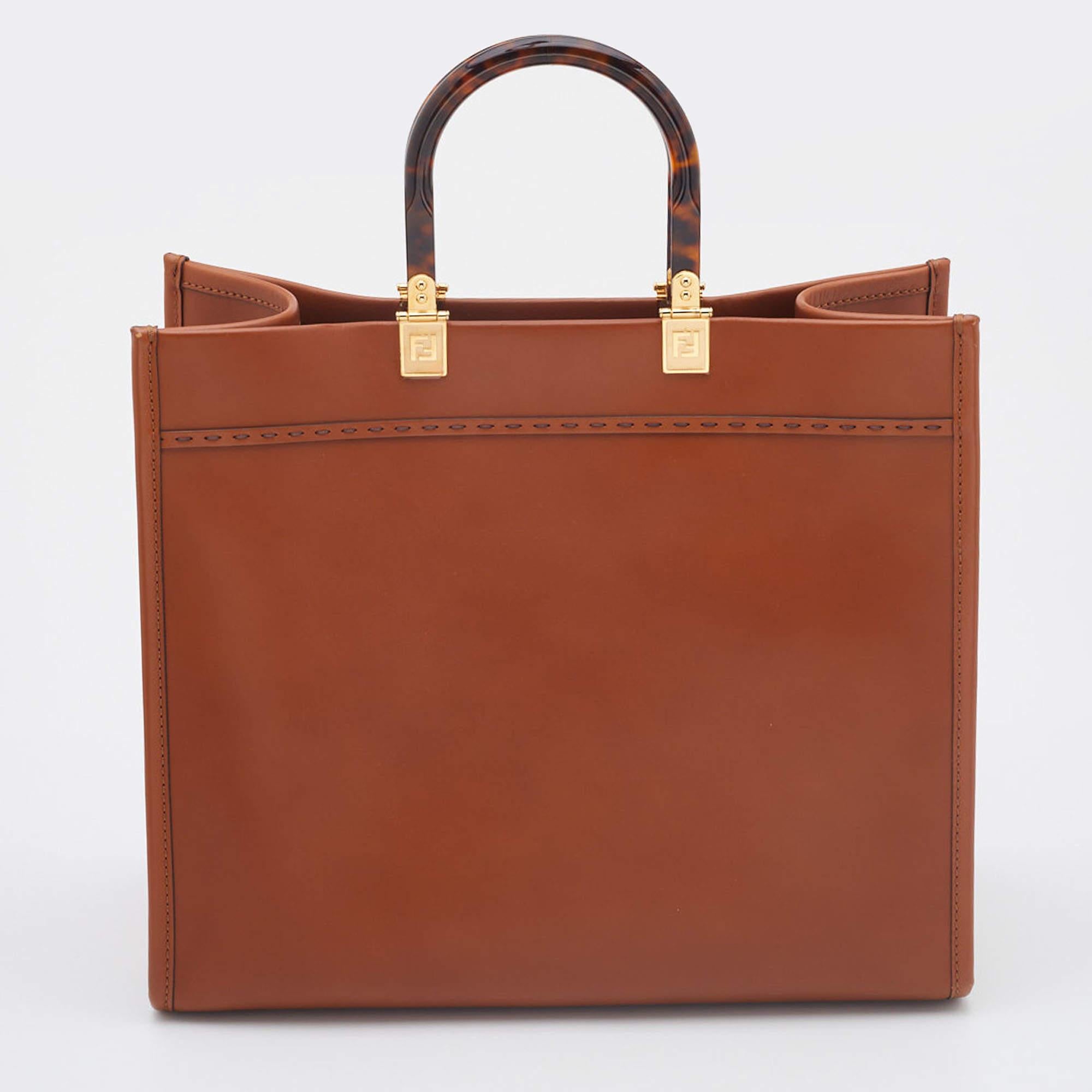 Know to create stylish, sophisticated, and timeless designs, Fendi is a brand worth investing in. The bags that come from this label's atelier are exquisite. This Sunshine tote bag is no different. It has been made from quality materials and comes