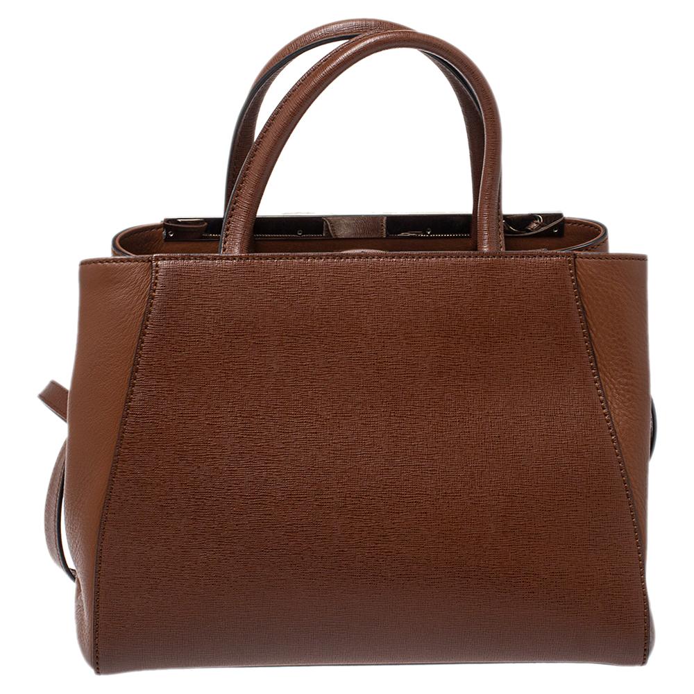 Fendi's 2Jours tote is one of the most iconic designs from the label and it still continues to receive the love of women around the world. Crafted from brown leather, the bag features double rolled handles. It is also equipped with a fabric interior