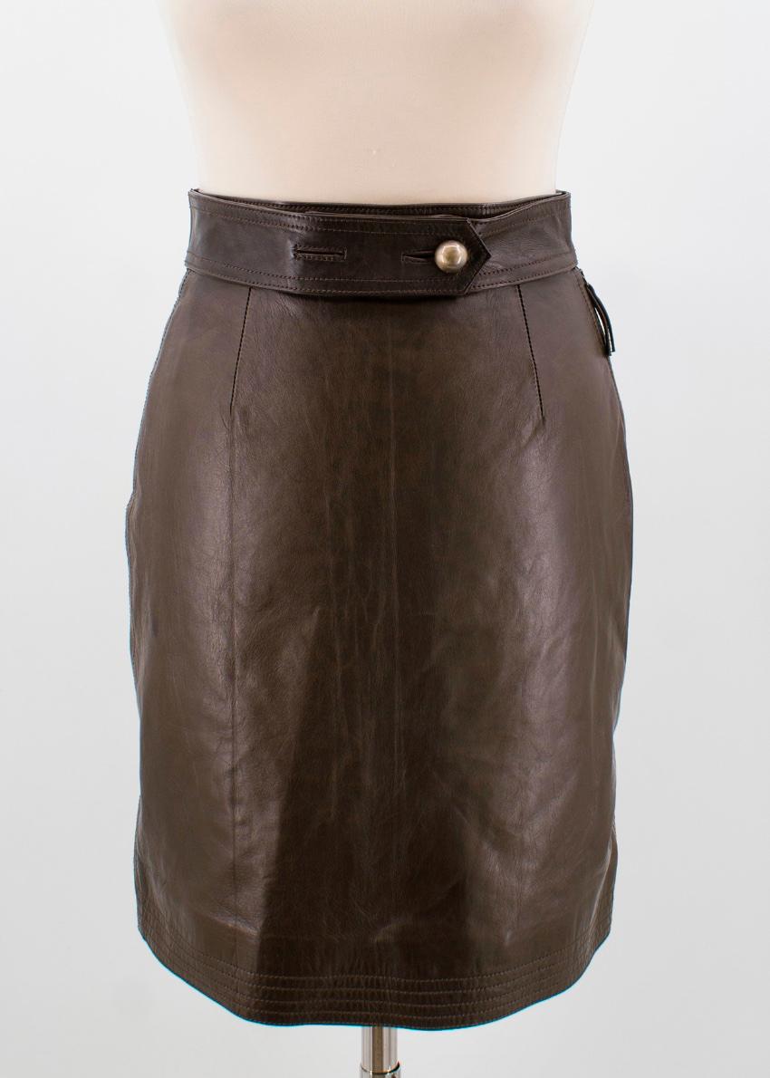 Fendi brown leather pencil skirt

Featuring:
-side zip fastening
-trapeze shape 
-fits high in the rise
-hem stitching detailing
-waist button belt 
Measurements are taken laying flat, seam to seam. 

Approx.
waist: 29cm 
hips: 42cm
length: 50cm
