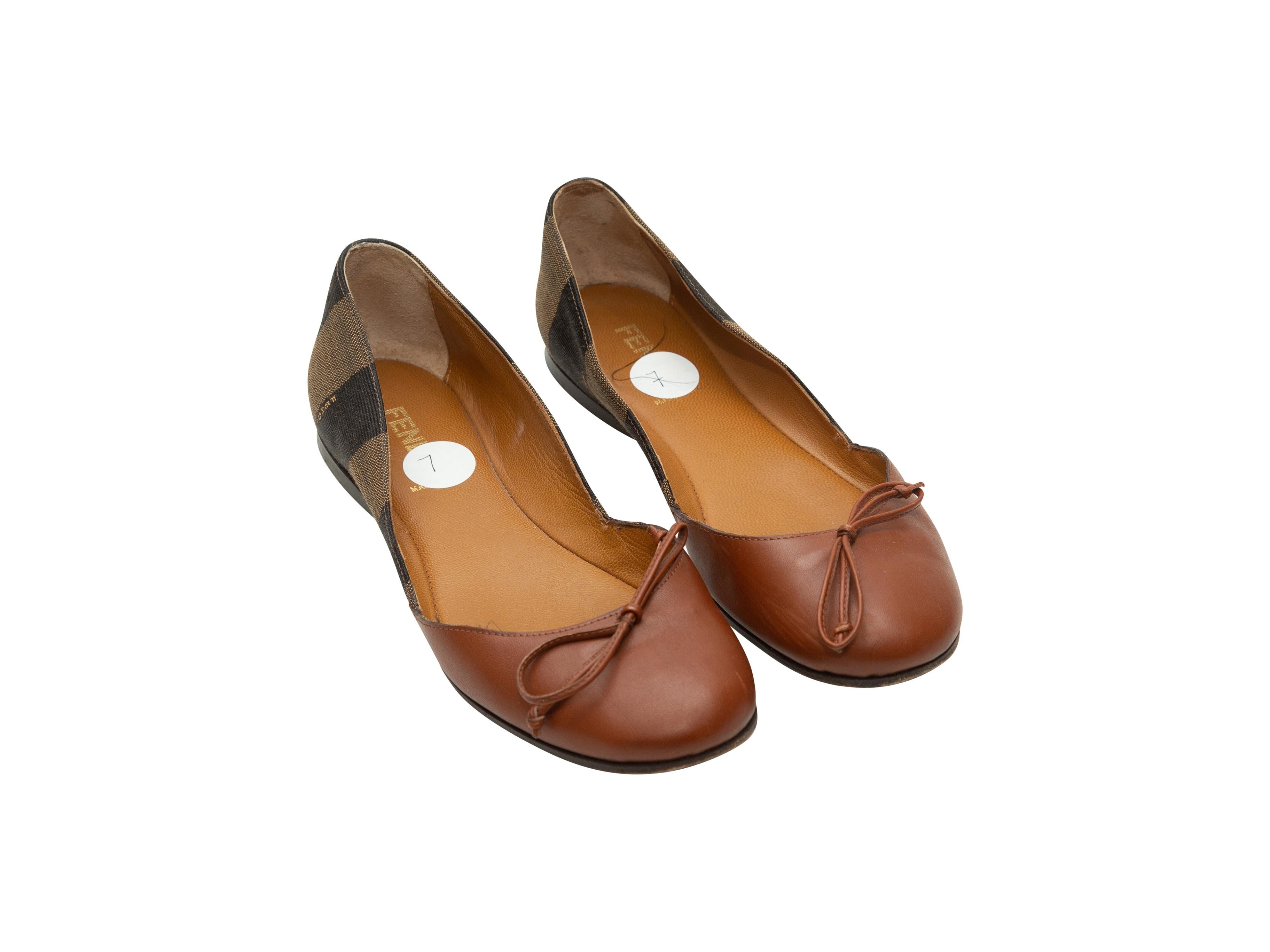 Product details: Brown leather and Pequin round-toe ballet flats by Fendi. Bow accents at tops. Designer size 37. 
Condition: Pre-owned. Good. Scuffing at outer soles. Wear at the interior toe box.
Est. Retail $ 825.00