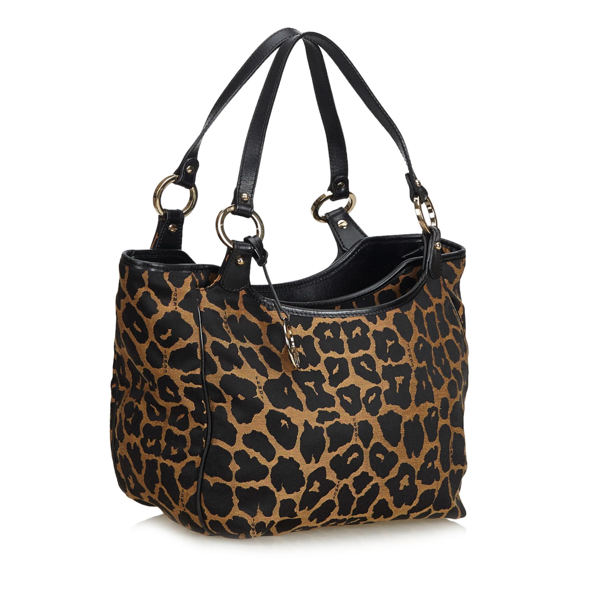 This shoulder bag features a jacquard body, flat leather straps, top zip closure, exterior open pockets, and an interior open pocket. It carries as B+ condition rating.

Inclusions: 
This item does not come with inclusions.

Dimensions:
Length: