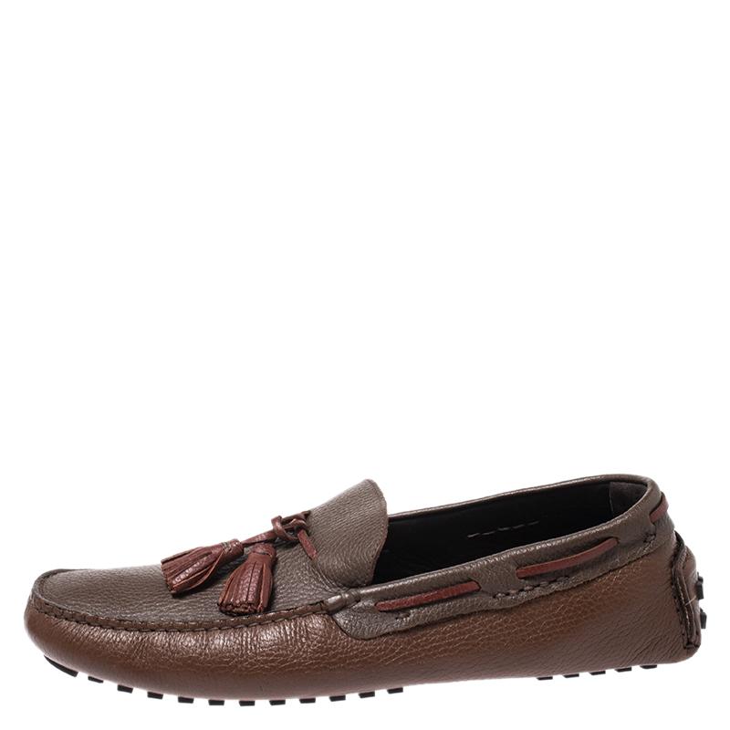 Fendi brings you these grand loafers that have been created with luxury in mind. They are covered in brown and maroon leather and detailed with tassels on the uppers and snug leather insoles meant to offer comfort in every step. The loafers are a