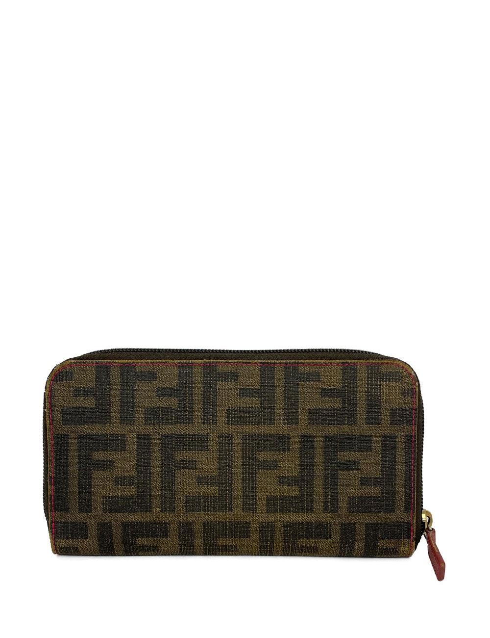 Fendi Zucca Print Tobacco Leather Wallet. Four slide pockets, one zipper pocket, and 12 card pockets on the inside. 

Additional information:
Material: leather 
Measurements: 19 W x 2 D x 10 H cm
Overall condition: fair
Interior condition: signs of