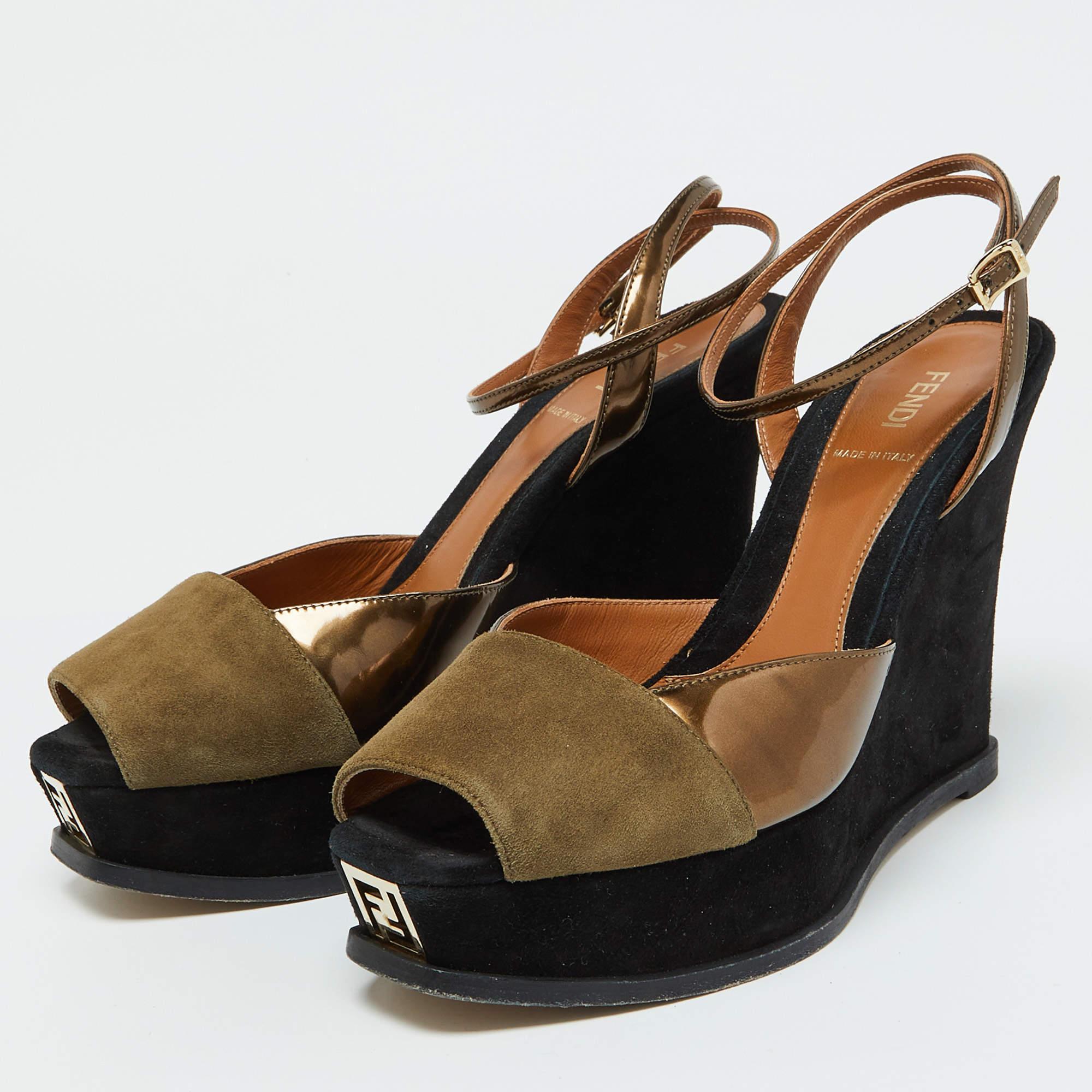 Exude class and perfection as you walk in these Fendista sandals from Fendi. They are crafted using suede and leather. They flaunt brand signature on the front  an ankle buckle closure  and wedge heels. Gold tone hardware is used to adorn their