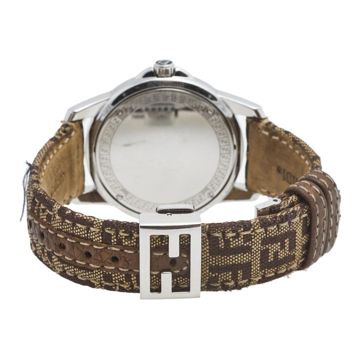 Complete your everyday look with this wristwatch. Made from stainless steel, the round case holds a smooth bezel and a brown dial packed with elegant hour markers, three hands, and a date window. The quartz watch has a simple FF clasp added to the