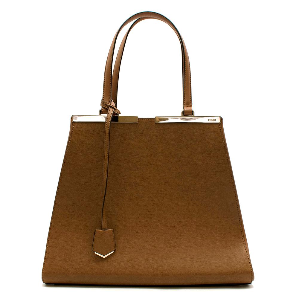 Fendi Brown Textured Leather 3 Jours Tote Bag

Established back in 1925, Italian fashion house Fendi never ceases to amaze the world with its style and elegance. This light brown coloured calf leather 3 Jours tote bag features round top handles, a
