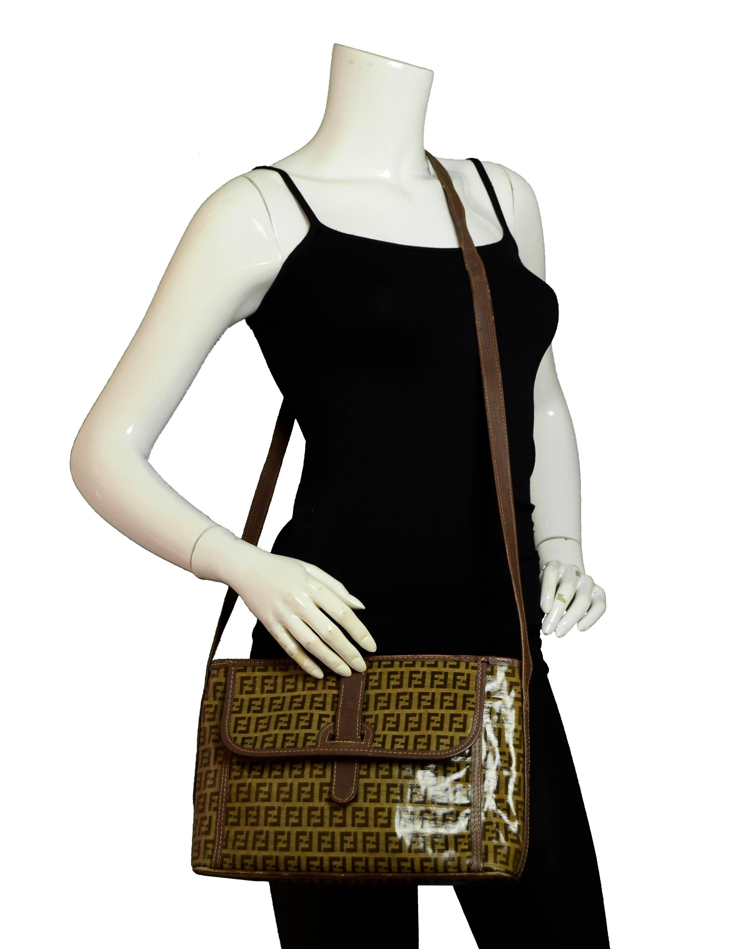 Fendi Brown Monogram Coated Canvas Messenger Bag

Made In: Italy
Year of Production: Vintage
Color: Brown monogram
Materials: Coated canvas
Lining: Vinyl
Closure/Opening: Middle zipper
Interior Pockets: One wall zipper
Exterior Pockets: Flap