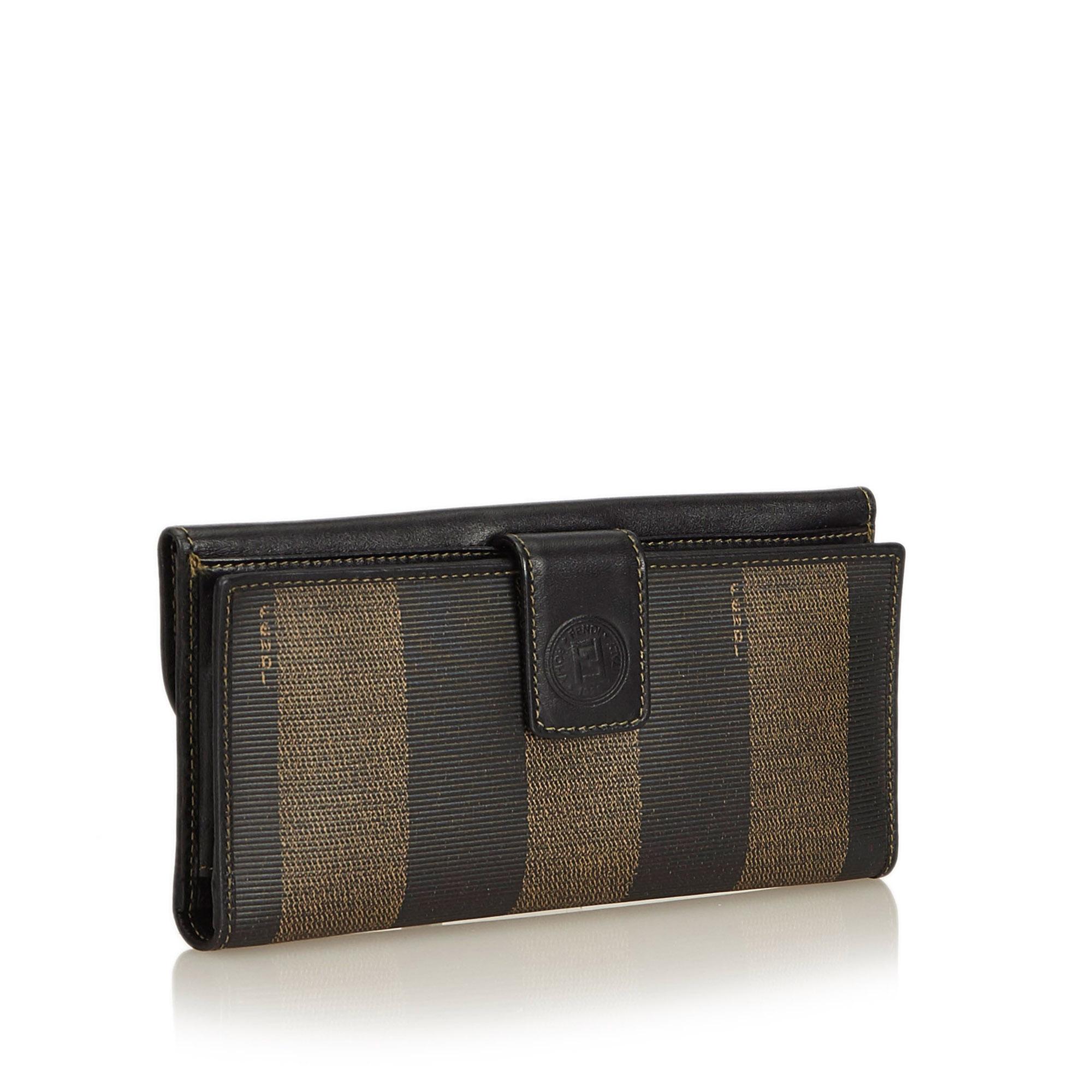 This wallet features a pvc body with leather trim, front flap, coin purse, and interior slip pockets. It carries as B+ condition rating.

Inclusions: 
Box

Dimensions:
Length: 9.50 cm
Width: 17.00 cm
Depth: 1.50 cm

Material: Plastic x PVC x Leather