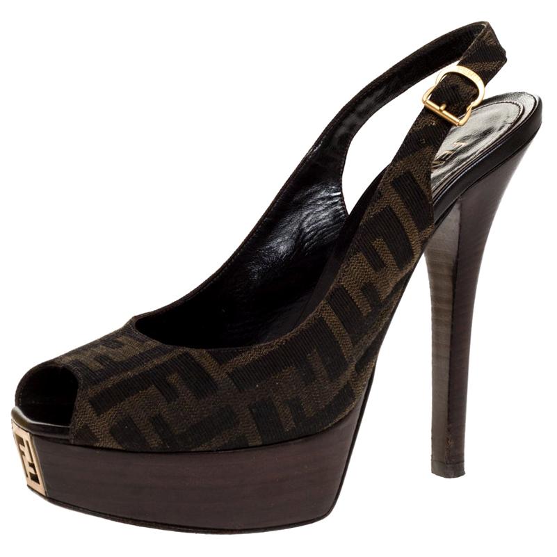 One look at this pair of Fendi sandals and our hearts skip a beat. Breathtakingly crafted from the brand's signature Zucca canvas, they feature peep toes, slingbacks, and the F logo on the platforms. They are complete with leather insoles and 14 cm