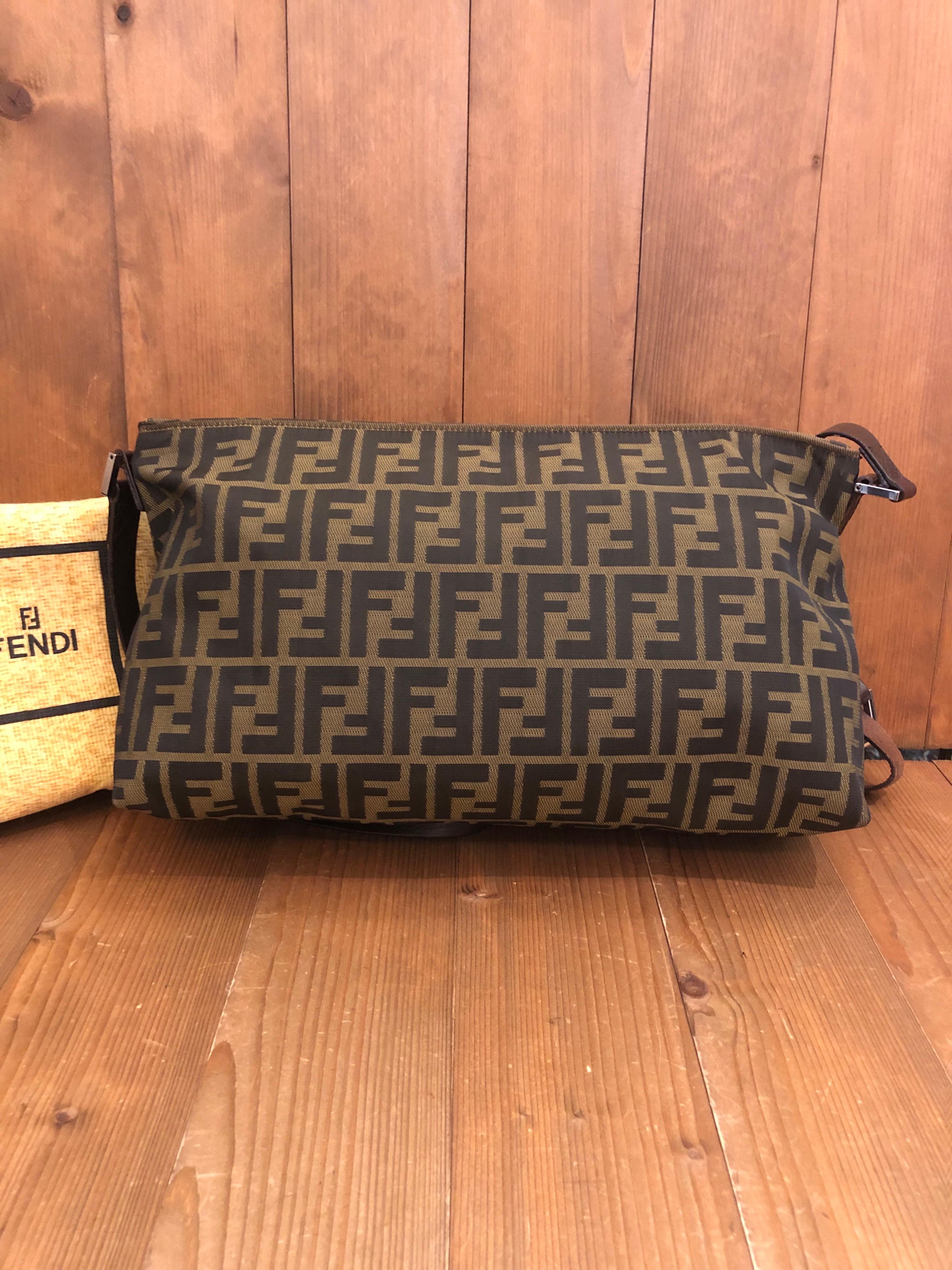 1990s FENDI Brown Zucca Jacquard Crossbody Bag with leather shoulder strap featuring one interior zip pocket. Made in Italy. Measures 14 x 7.5 x 4.75 inches Drop 17 inches. Comes with dust bag. 

Condition - minor signs of wear. Generally in very