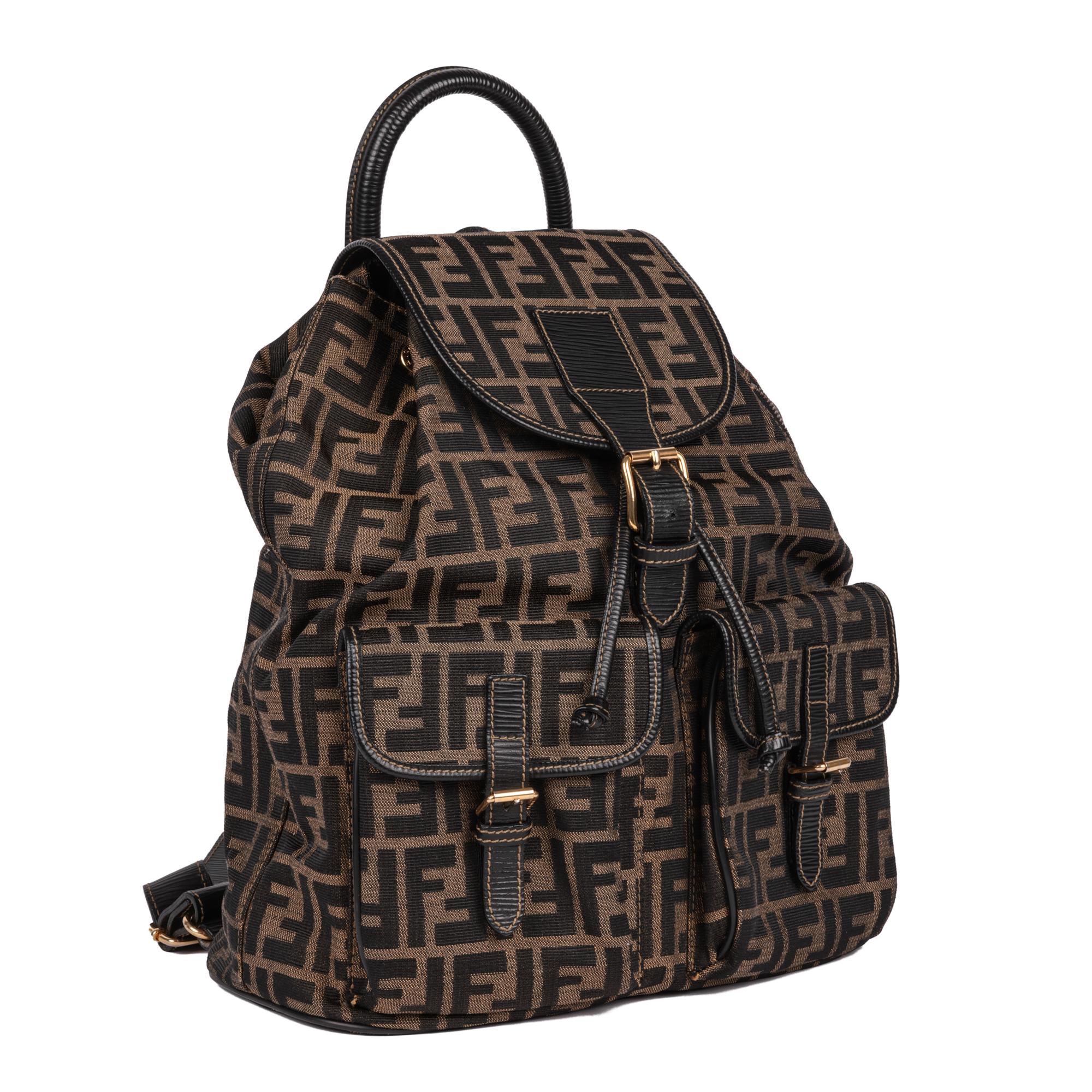 FENDI
Brown Zucca Monogram Canvas & Textured Calfskin Leather Vintage Backpack

Serial Number: (Hard to Read)
Age (Circa): 2000
Authenticity Details: Serial Stamp (Made in Italy)
Gender: Ladies
Type: Backpack

Colour: Brown
Hardware: