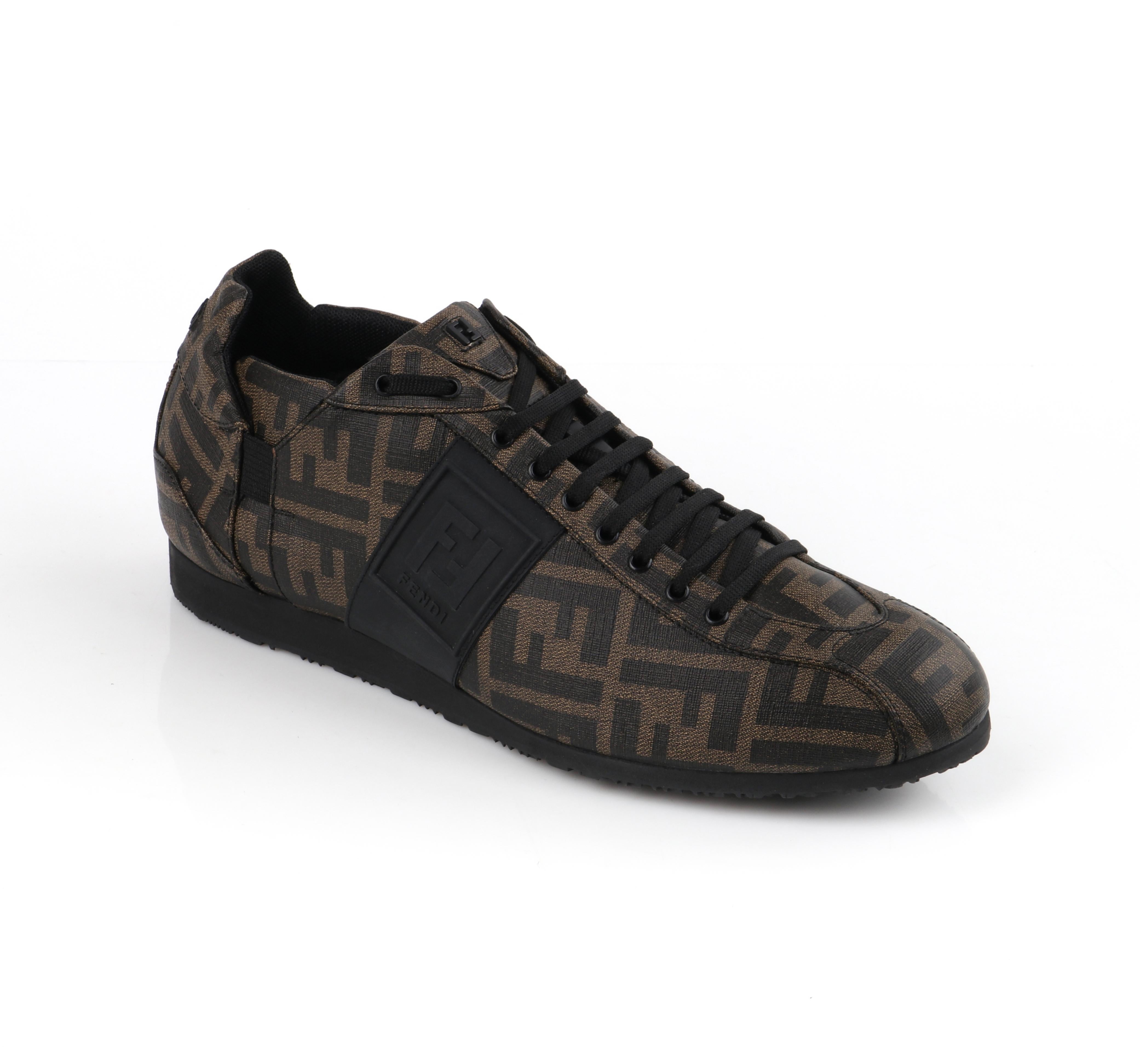 FENDI Brown Zucca Monogram Coated Canvas Logo Mens Low Top Sneaker Shoes
 
Brand / Manufacturer: Fendi
Designer: Karl Lagerfeld
Style: Low top sneakers
Color(s): Shades of brown, black (exterior, interior)
Unmarked Fabric Content: Coated canvas