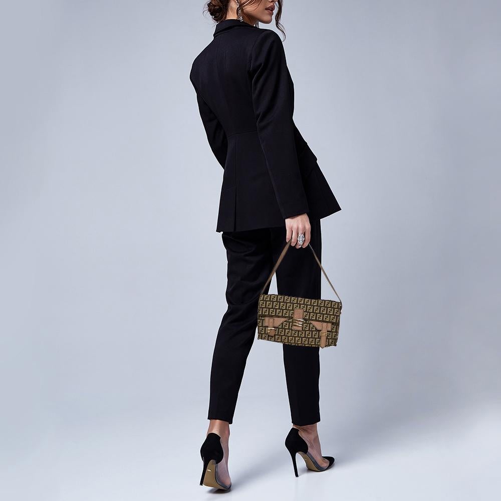 The Baguette was created by Silvia Venturi Fendi in 1997, and it was an instant rage! Made from canvas and leather, the bag has the FF logo on the flap and the buckles. It suspends from a slender strap and is equipped with a well-sized interior for