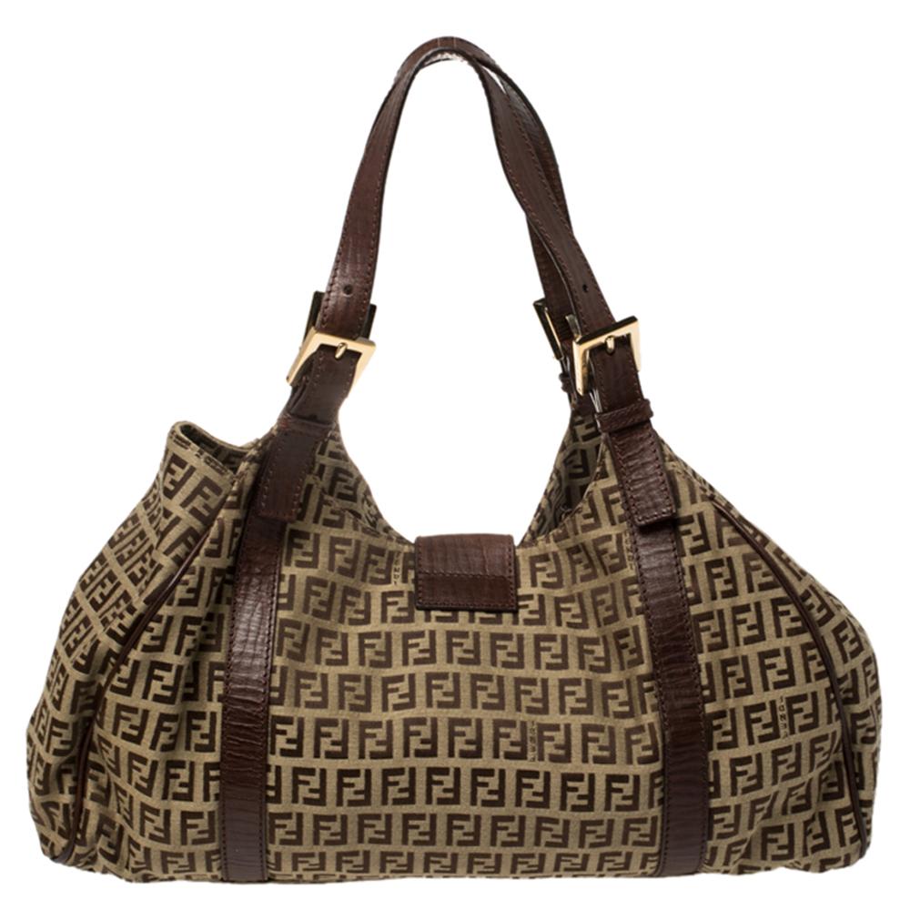 This shoulder bag by Fendi is a practical choice perfect for carrying your daily needs. The fabric interior is well-sized and the Zucchino canvas & leather exterior adds to its beauty. This piece is a must-have for every woman.

Includes: Original