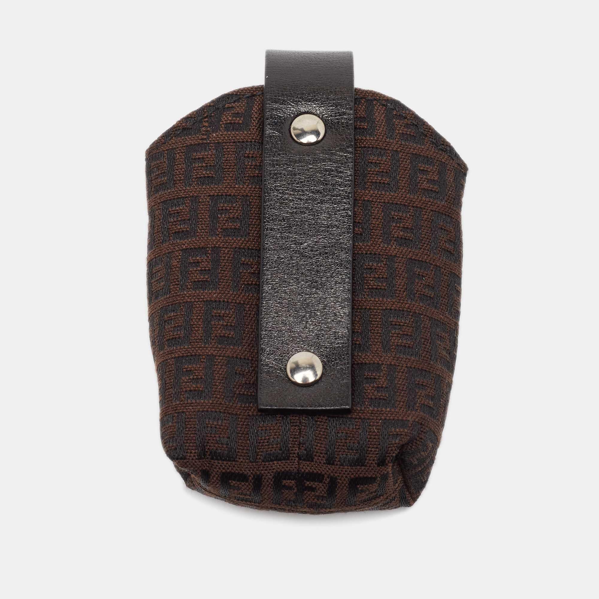 Opt for a stylish way to protect your phone with this Fendi cover crafted from Zucchino canvas and leather. It has a little strap closure.