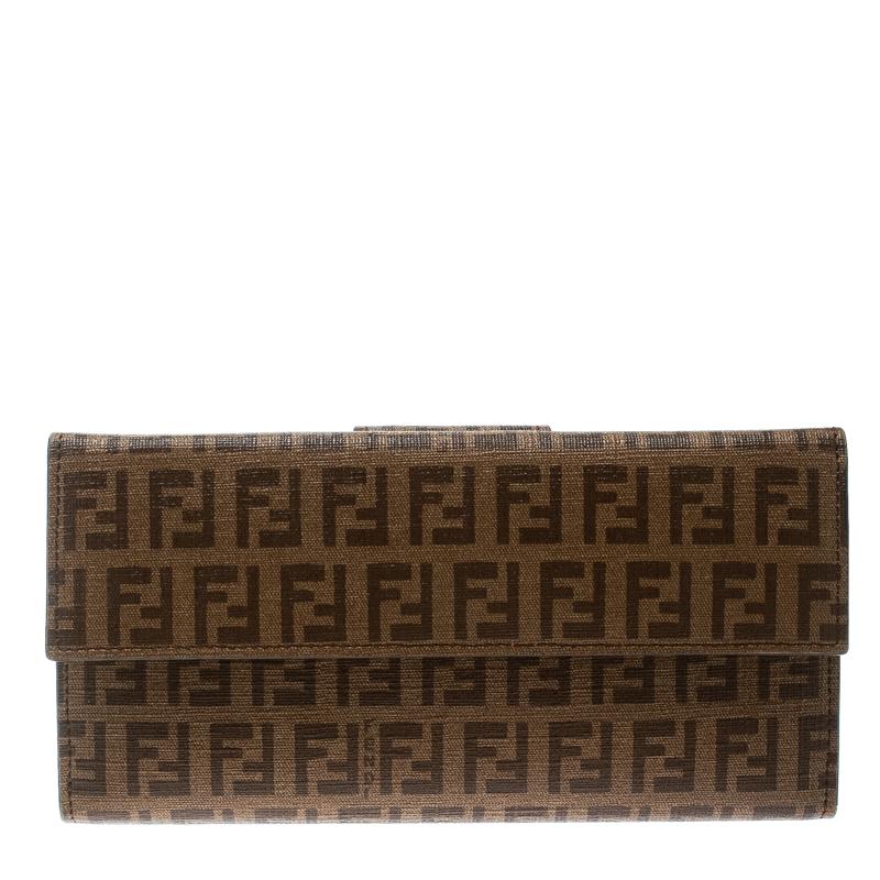 This splendour of a wallet from the house of Fendi is crafted from Zucchino canvas and is equipped with a Forever lock flap that reveals multiple slots and compartments to neatly carry your cash and cards. This creation is definitely sleek and