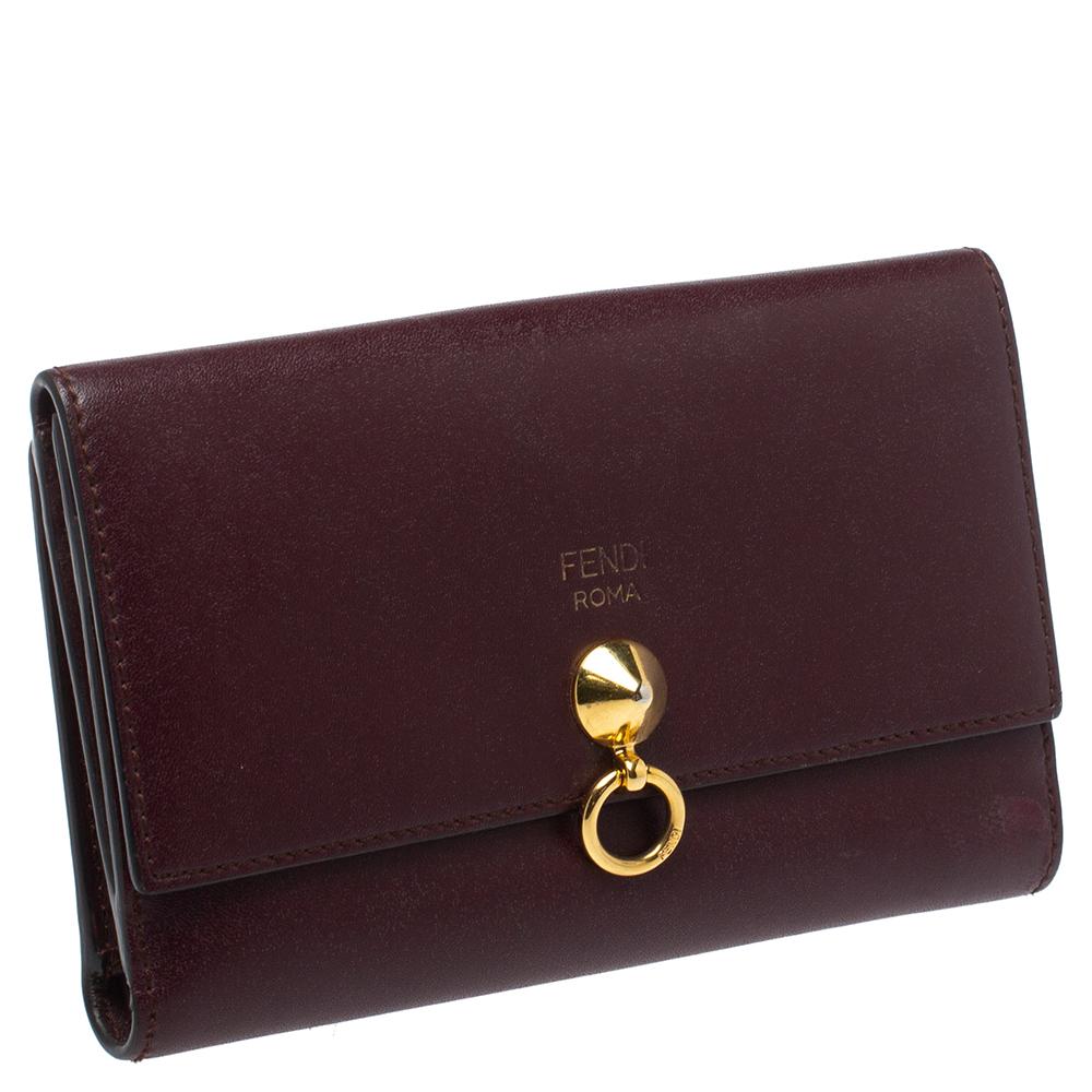 Bringing a fine mix of fashion and fine craftsmanship is this wallet from Fendi. The wallet comes crafted from burgundy leather and designed with multiple card slots and compartments. Gold-tone hardware completes the wallet.

