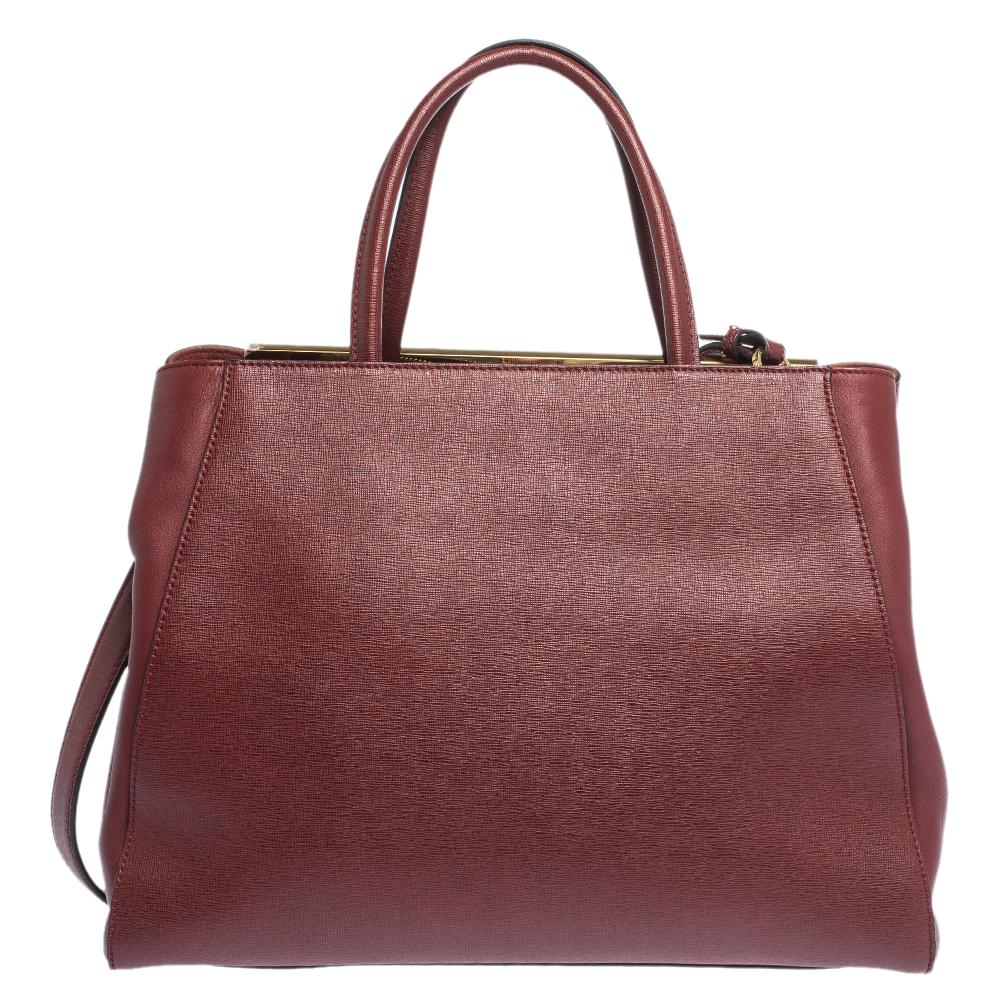 Fendi's 2Jours tote is one of the most iconic designs from the label and it still continues to receive the love of women around the world. Crafted from burgundy leather, the bag features double rolled handles. It is also equipped with a suede and