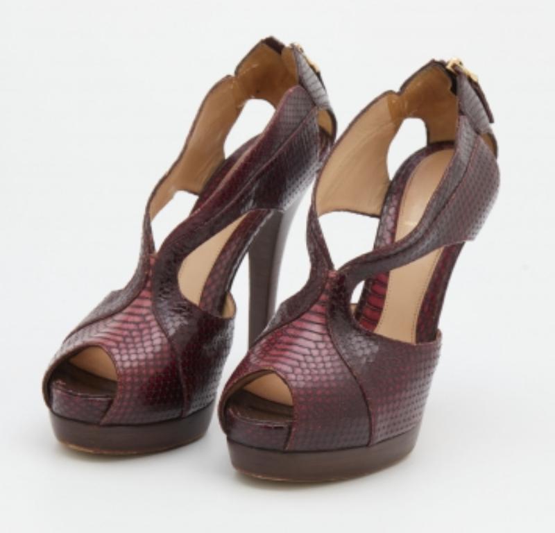 These sandals from Fendi will lend a stylish and playful edge to your feet. The python leather shoes have a strappy front, platforms, and 14.5cm heels. Lined with the finest quality leather, these are not only attractive but also durable.