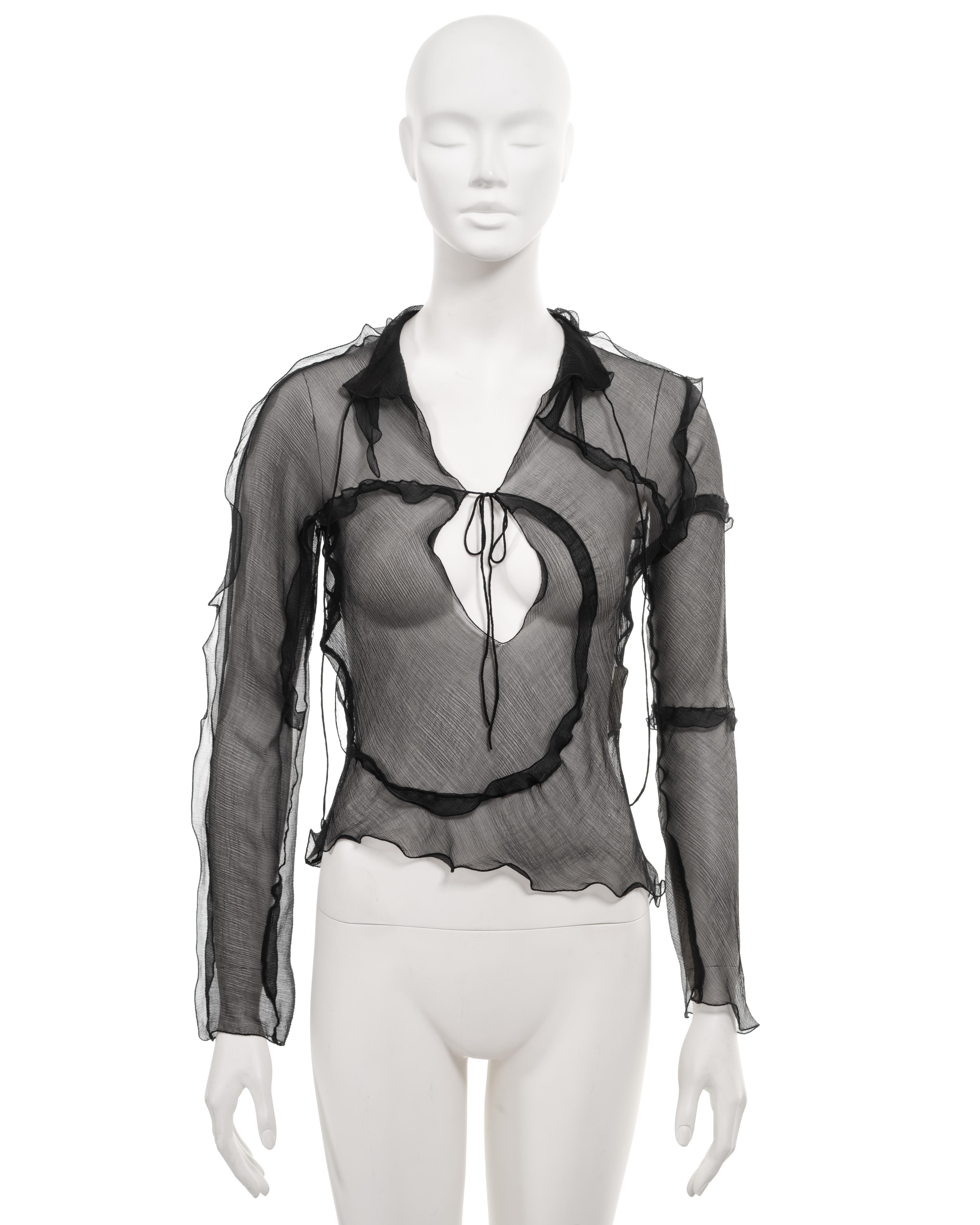 ▪ Fendi archival blouse
▪ Creative Director: Karl Lagerfeld
▪ Sold by One of a Kind Archive
▪ Spring-Summer 2000
▪ Constructed from bias-cut black crinkled silk chiffon
▪ Ruffled trim
▪ Multi-panelled 
▪ String ties fastening at the collar and chest