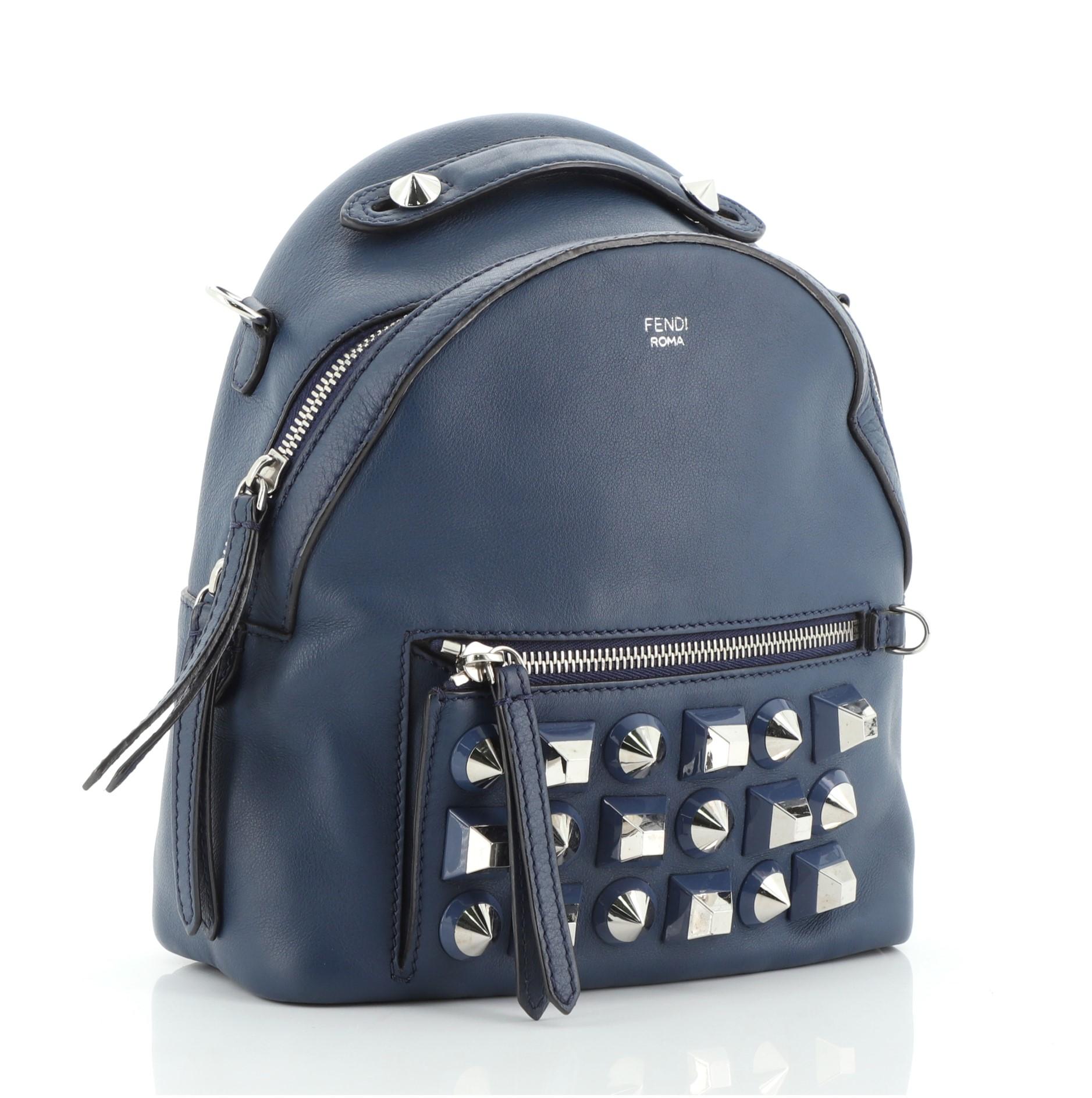 Fendi By The Way Backpack Crossbody Studded Leather Mini
Blue

Condition Details: Wear on base corners, moderate creasing on exterior, minor wear on strap. Splitting on opening trim wax edges, light cracking on strap wax edges, wear and marks in