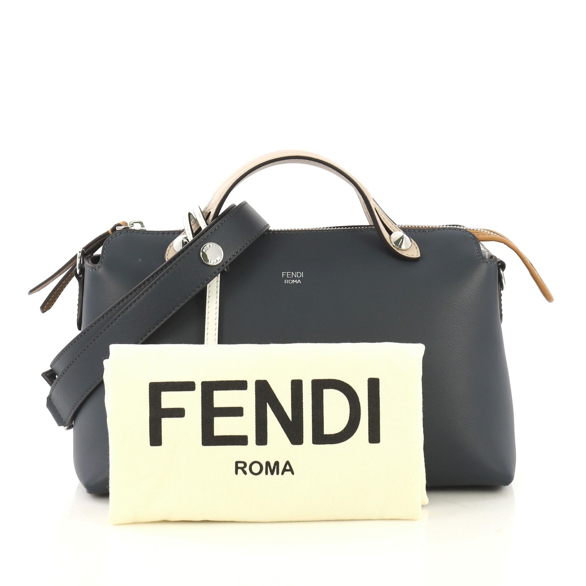 This Fendi By The Way Satchel Calfskin Small, crafted from navy blue calfskin leather, features dual flat leather top handles and silver-tone hardware. Its zip closure opens to a dark brown fabric interior with a middle zip compartment and slip