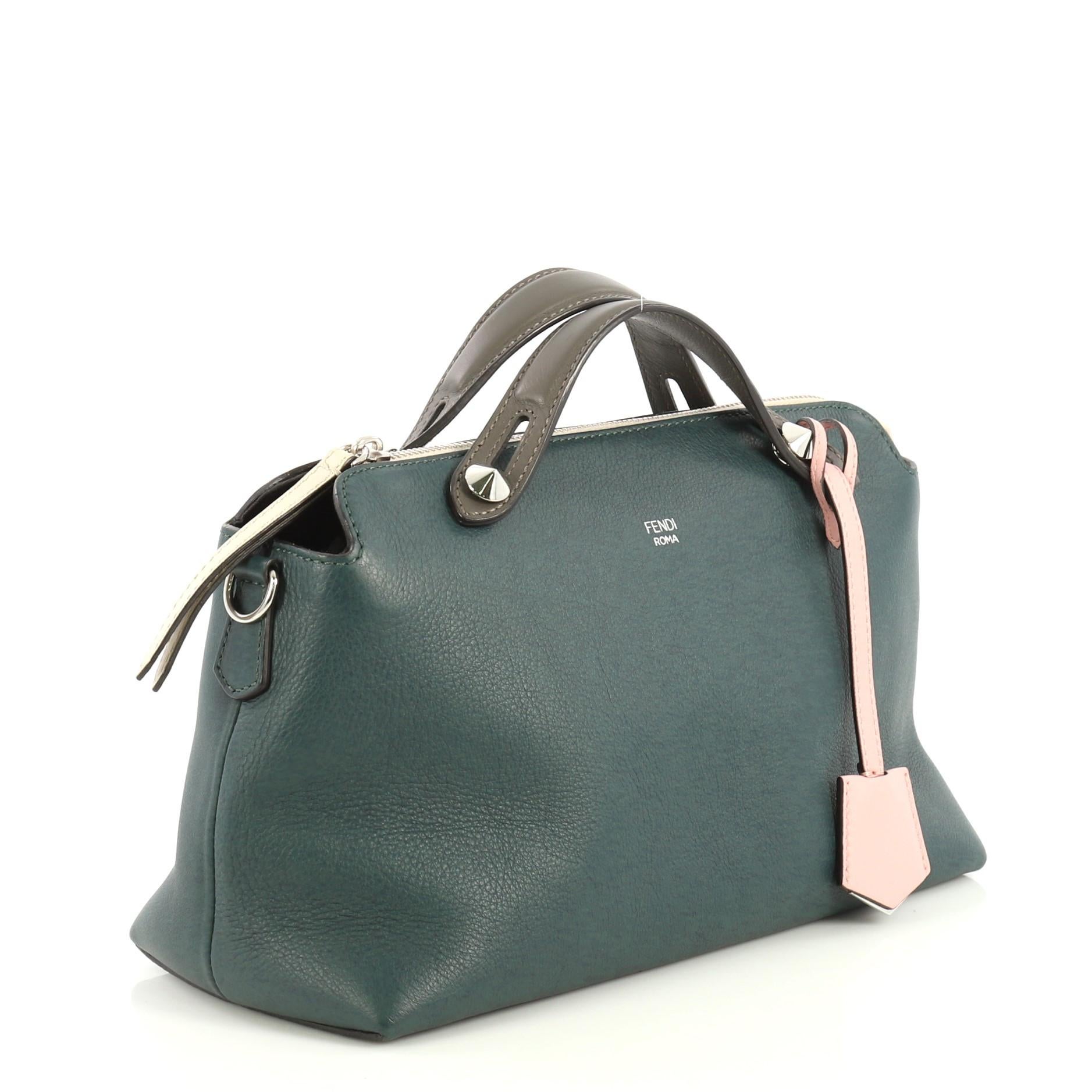 This Fendi By The Way Satchel Calfskin Small, crafted from green calfskin leather, features dual flat leather top handles and silver-tone hardware. Its zip closure opens to a brown fabric interior with middle zip compartment and slip pockets.
