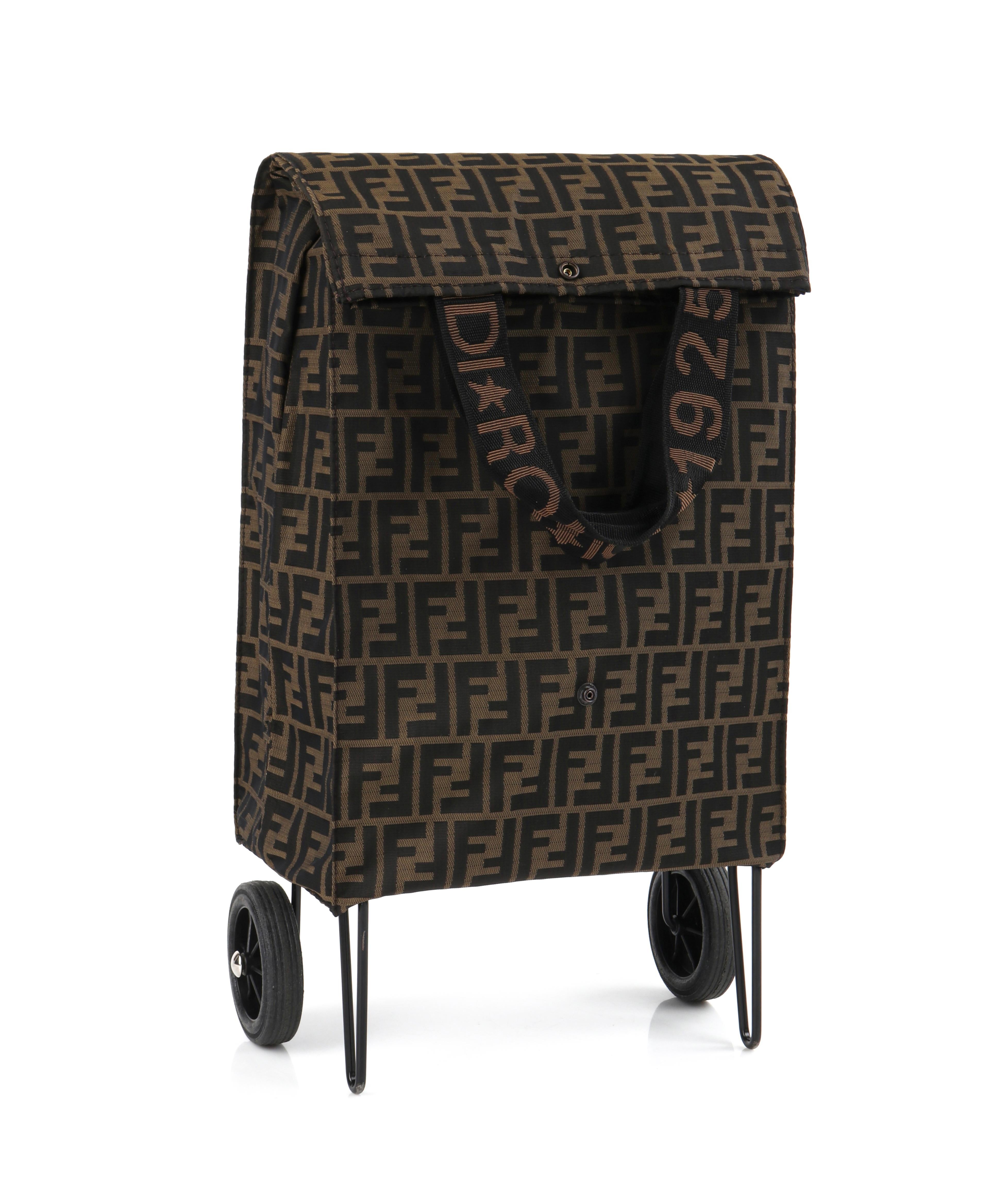 FENDI c.1980s Jolly Trailer Multiway Monogram Canvas Soft Cover Luggage Bag 
 
Brand / Manufacturer: Fendi
Circa: 1980’s
Manufacturer Style Name: “Jolly Trailer”
Style: Carry on suitcase
Color(s): Shades of tan, brown, and black
Lined: Yes
Unmarked