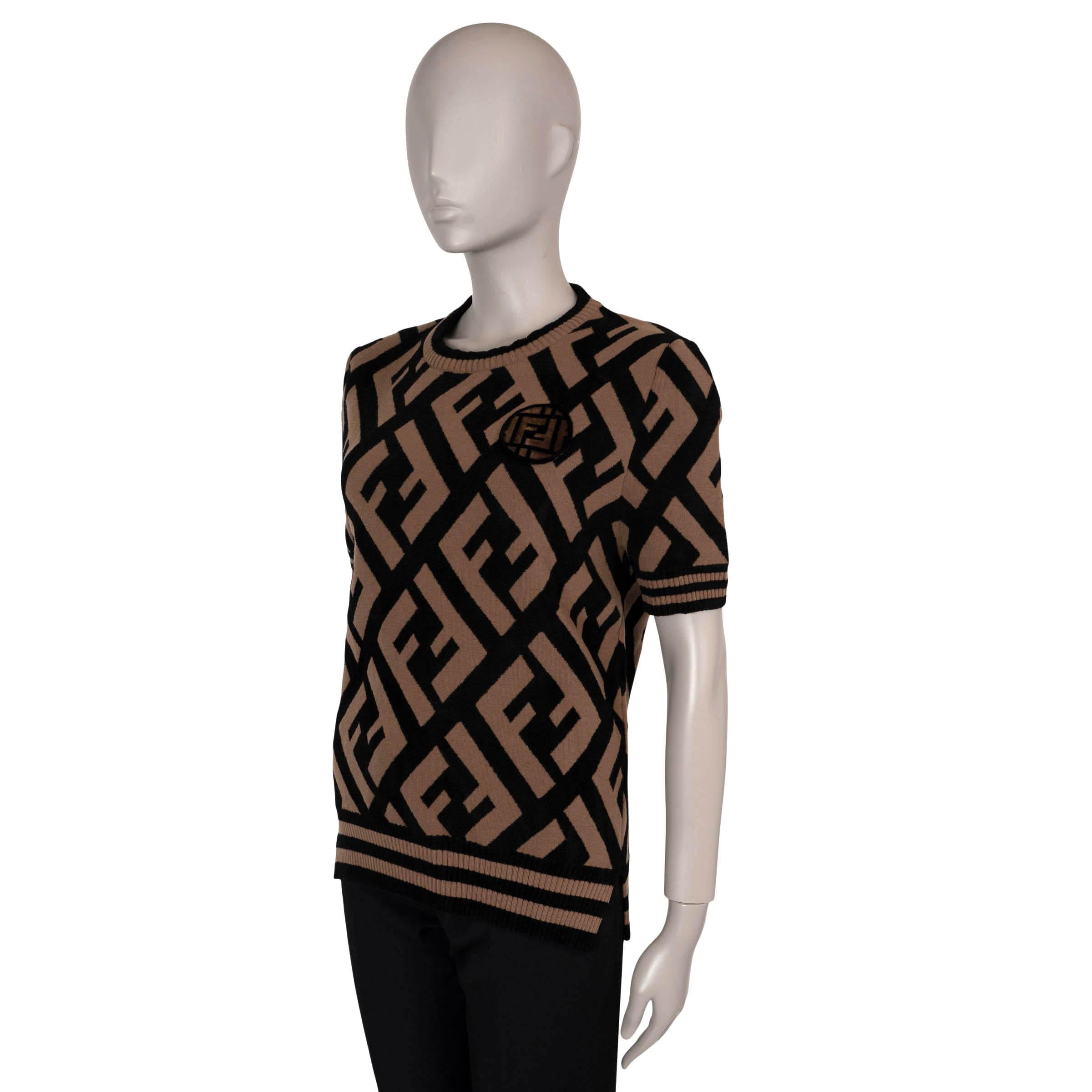 This 100% authentic Fendi knit T-shirt in camel and black is crafted from a soft blend of wool (36%), viscose (32%), polyamide (27%), and elastane (5%). It features an oversized Zucca jacquard pattern, a round neck, and striped rib-knit trims,