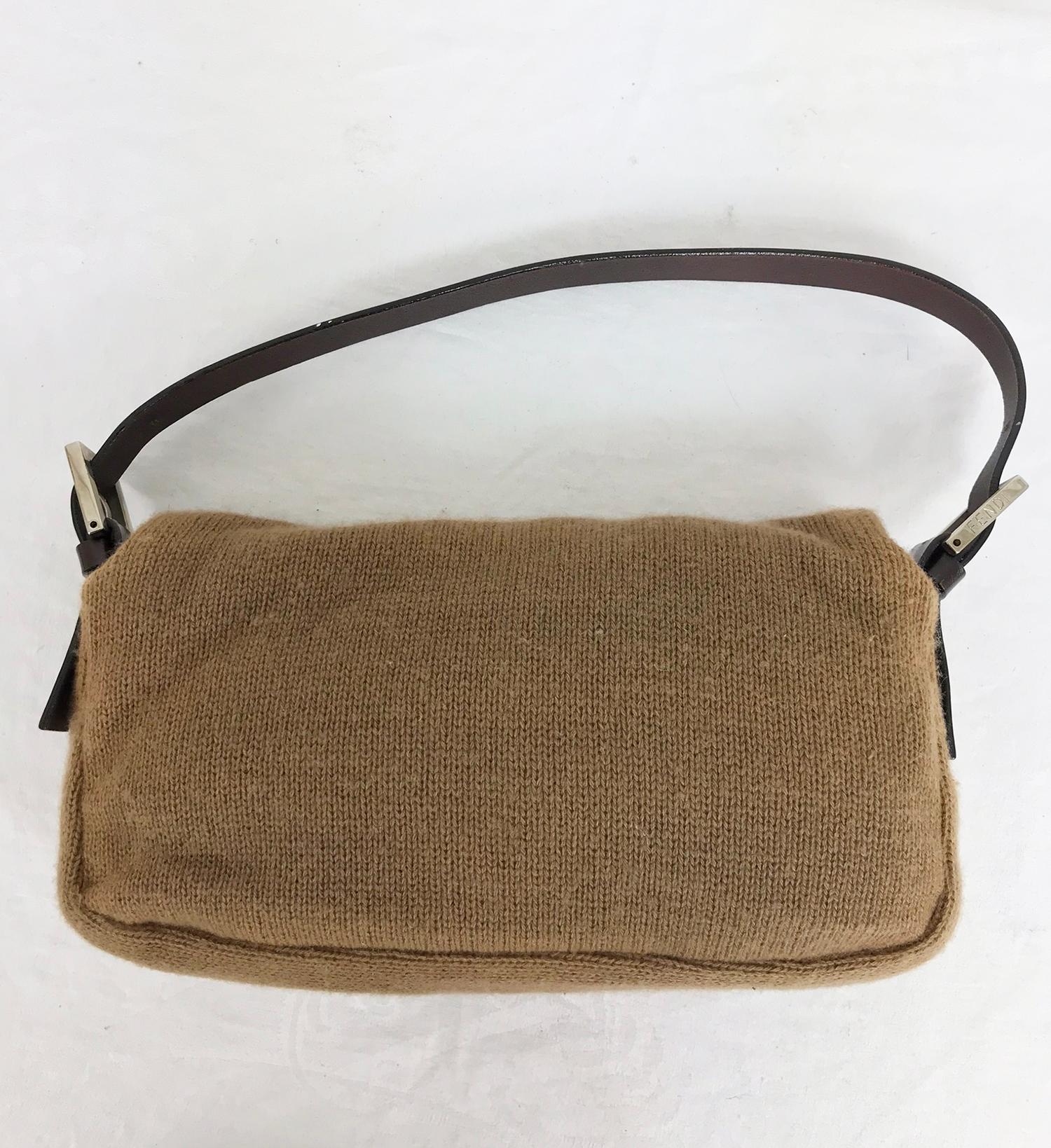 Fendi camel knit cashmere and leather baguette original from 1997. Soft double ply knit cashmere with dark chocolate brown leather trims and silver hardware. The bag has adjustable strap with logo hardware on either side. Lined in gold satin with a