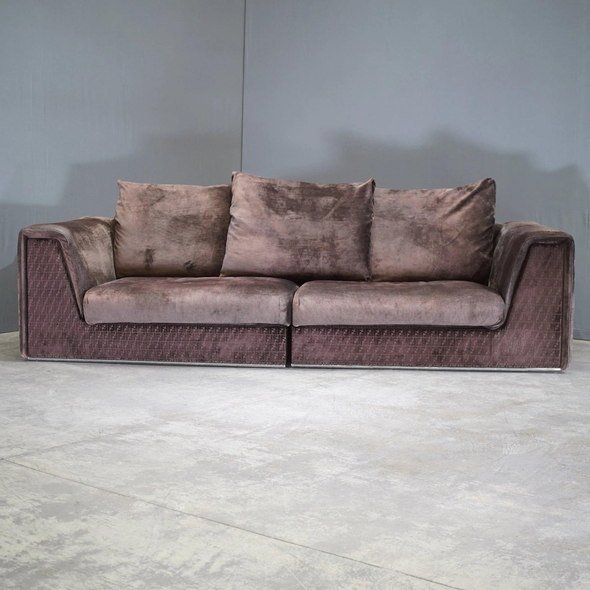 Introducing the luxurious Fendi Casa Prestige Sofa, an epitome of elegance and high-end design. This exquisite 3-4 seater sofa boasts the rare and coveted FF monogram, embodying the perfect blend of style and comfort. Upholstered in premium brown
