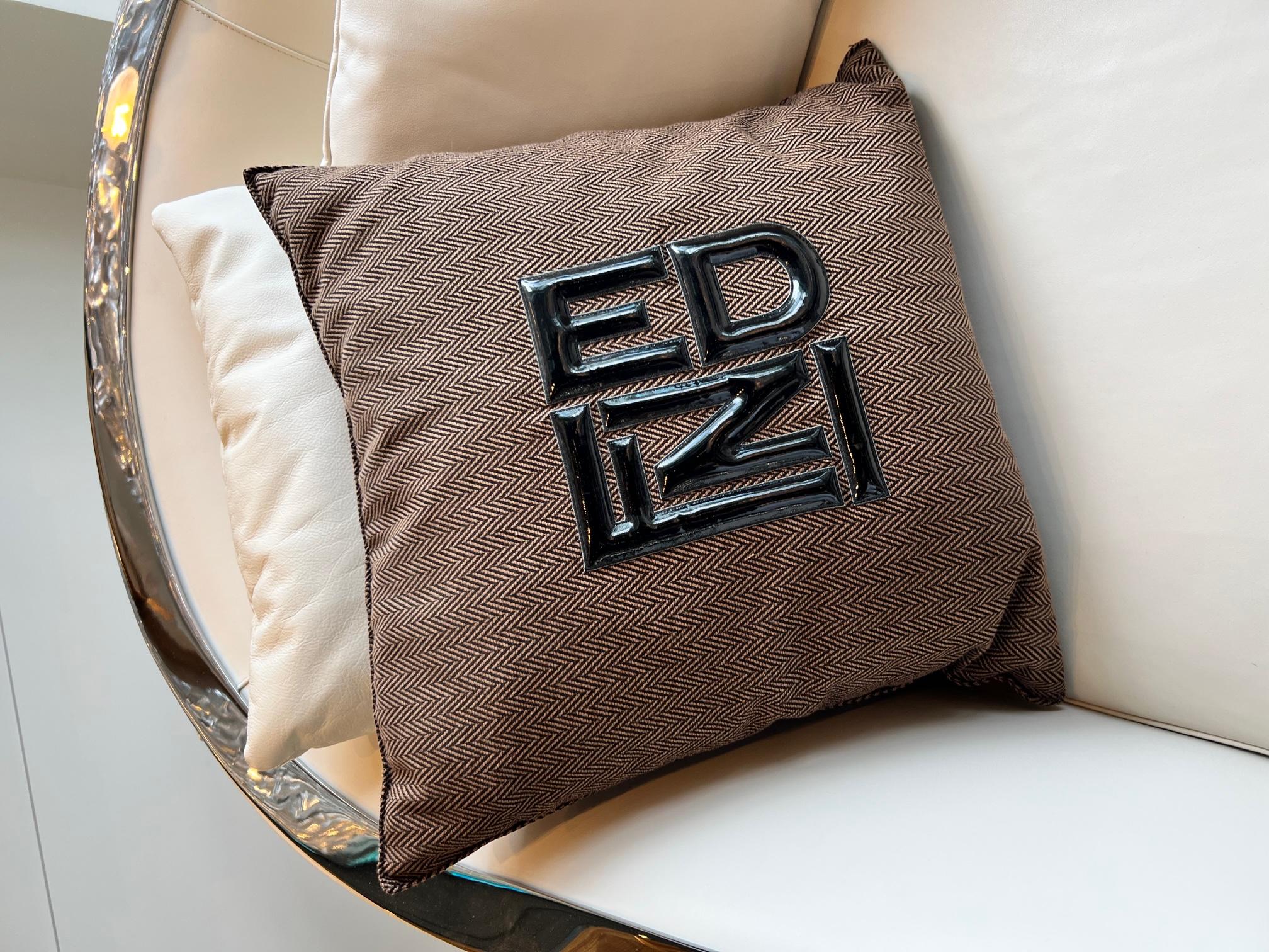 Chevron fabric cushion with patent leather black Fendi logo raised, with zipper bottom