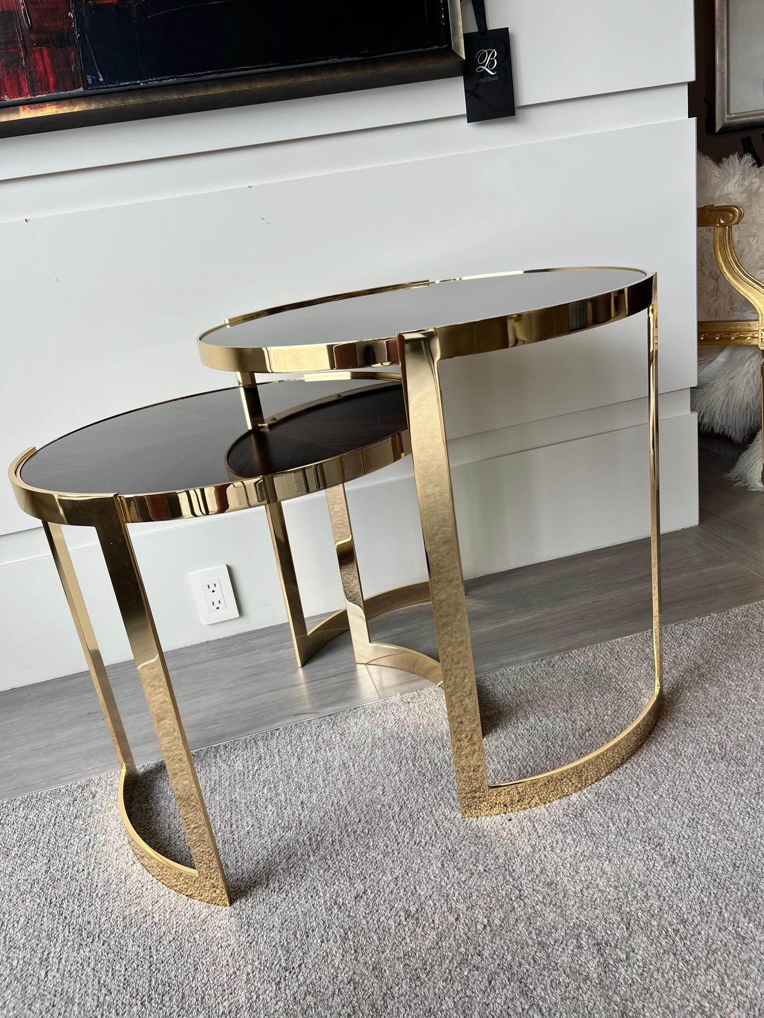 These gorgeous rosewood and brass lacquered nesting tables are beautifully streamlined for any modern or contemporary interior.