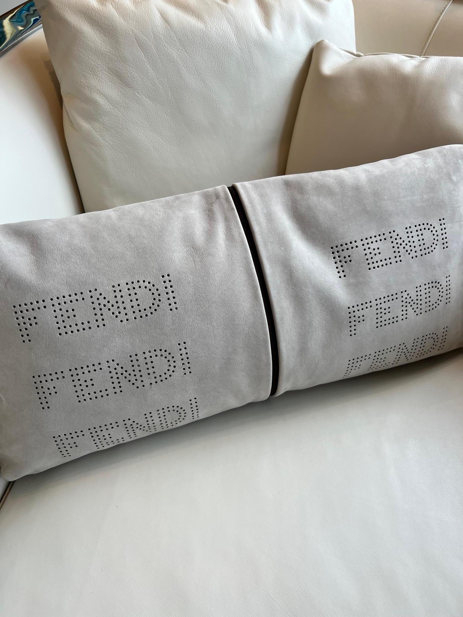 Italian Fendi Casa taupe suede kidney pillow with perferated Fendi bask and chocolate  For Sale