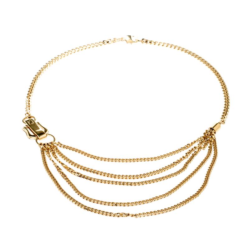It is definitely Love At First Sight with this Fendi necklace. Beautifully designed with gold-tone metal, the piece has gorgeous layers of chains and a signature buckle accent. The neckpiece is complete with a lobster clasp. It is, without a doubt,