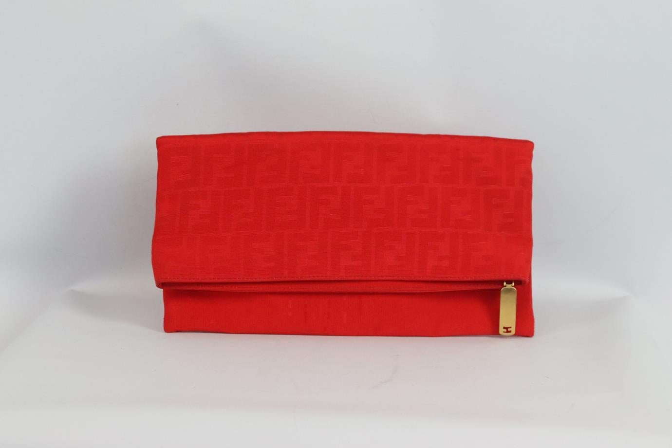 Fendi Chameleon ff jacquard grosgrain clutch. Made from durable red grosgrain with the brand’s iconic ff jacquard, it has a large internal compartment and fold over silhouette. Red. Zip fastening at top. Comes with dustbag. Height: 7.25in. Width: