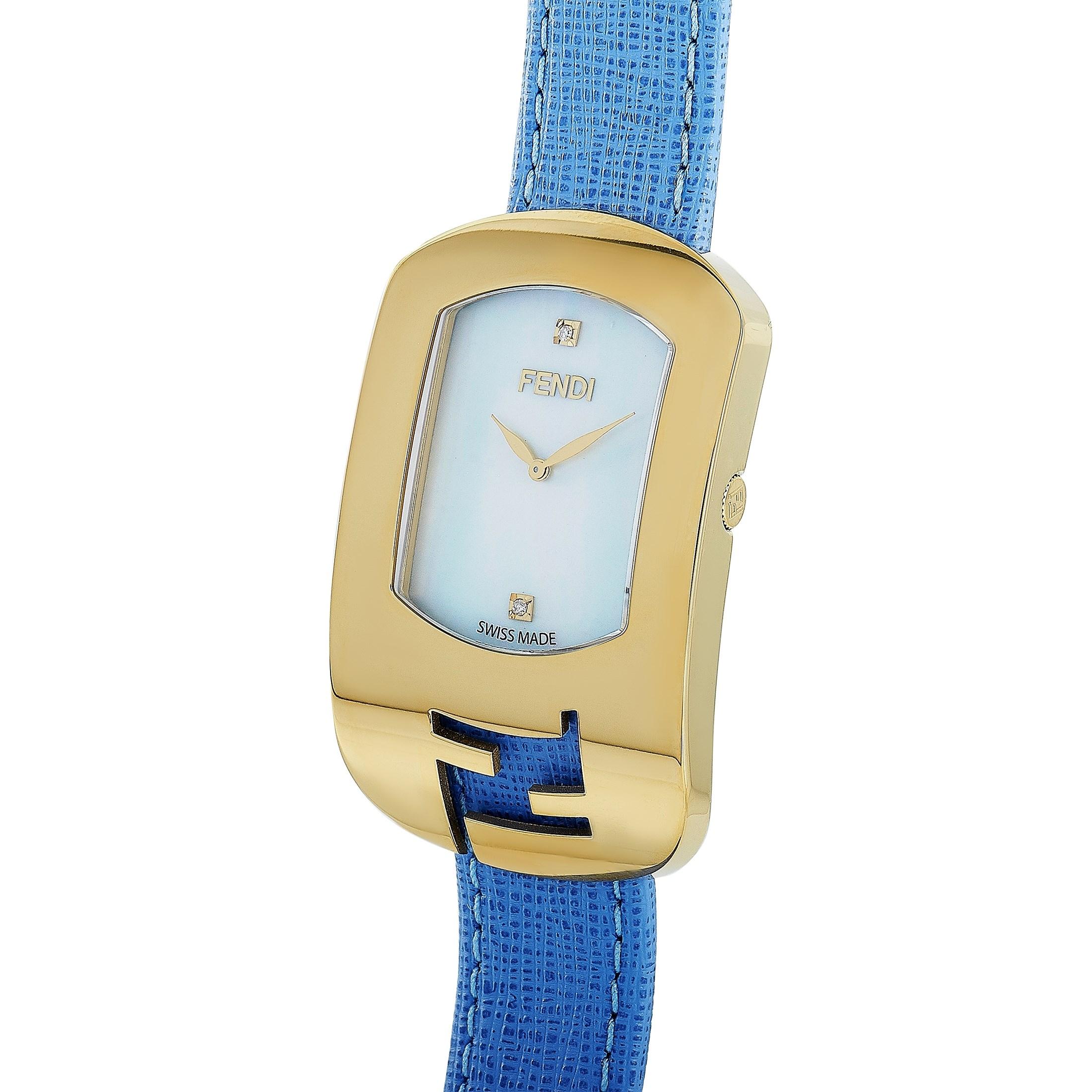 This is the Fendi Chameleon watch, reference number F300434532D1.

It is presented with a gold-tone stainless steel case that offers water resistance of 30 meters. The watch is worn on a blue leather strap fitted with a tang buckle. The mother of