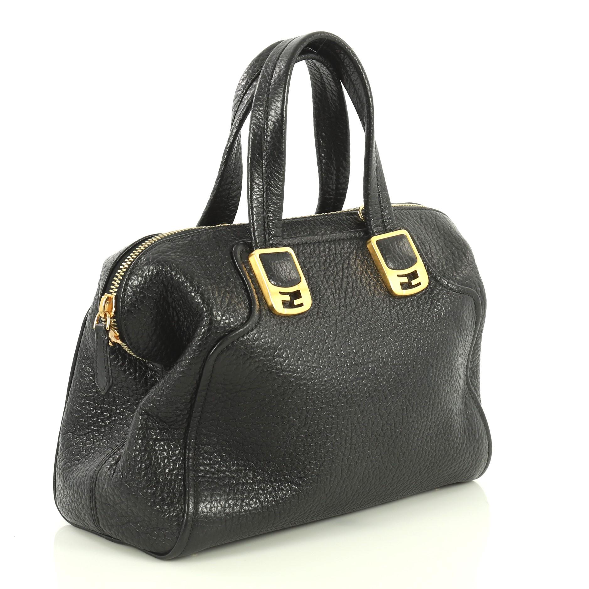 This Fendi Chameleon Satchel Leather Medium, crafted in black leather, features dual top handles accented with FF logo hardware, protective base studs, and gold-tone hardware. Its two-way zip closure opens to a gray fabric interior with middle zip