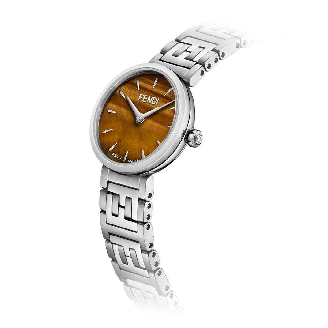 FENDI CHAMFERED TIGER'S EYE DIAL LADIES WATCH F103101001 
Forever Fendi Collection.

-Stainless steel
-Movement: Quartz
-Case size: 19 mm
-Chamfered tiger's eye dial
-FF logo patter on the bracelet
-Water proof: 5ATM

Comes with Box &