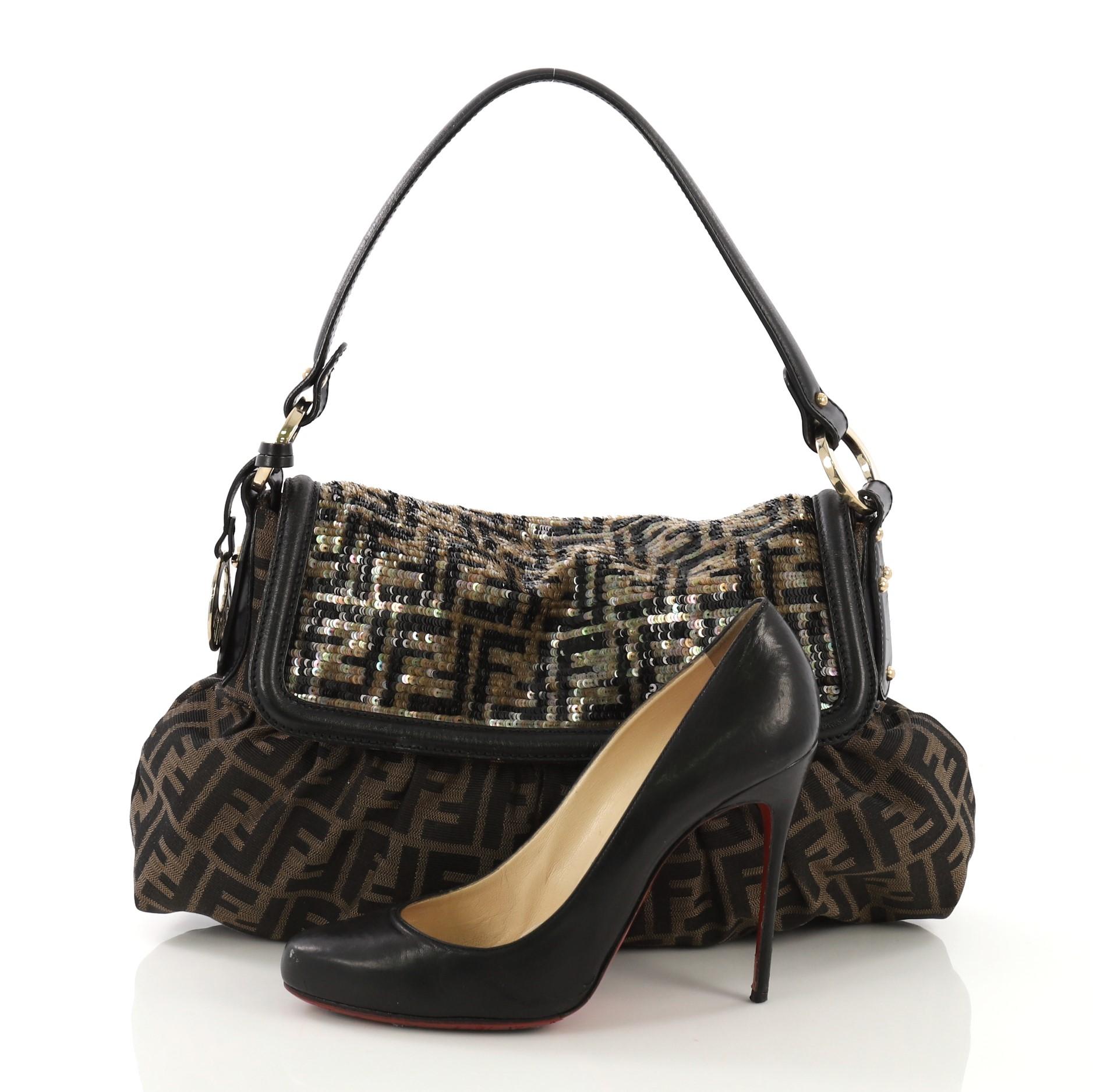 This Fendi Chef Flap Bag Zucca Canvas with Sequins Medium, crafted from brown zucca canvas with sequins, features a leather shoulder strap, leather trim, and gold-tone hardware. Its flap opens to a black fabric interior with zip pocket. **Note: Shoe