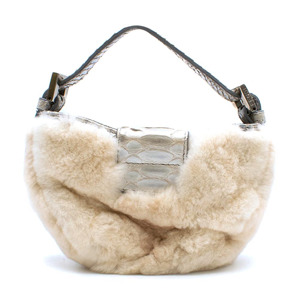 Fendi Chinchilla Fur & Python Mini Baguette

- Crystal Embellished FF Logo
- Python Strap 
- One compartment 
- Silk linings

Please note, these items are pre-owned and may show some signs of storage, even when unworn and unused. This is reflected