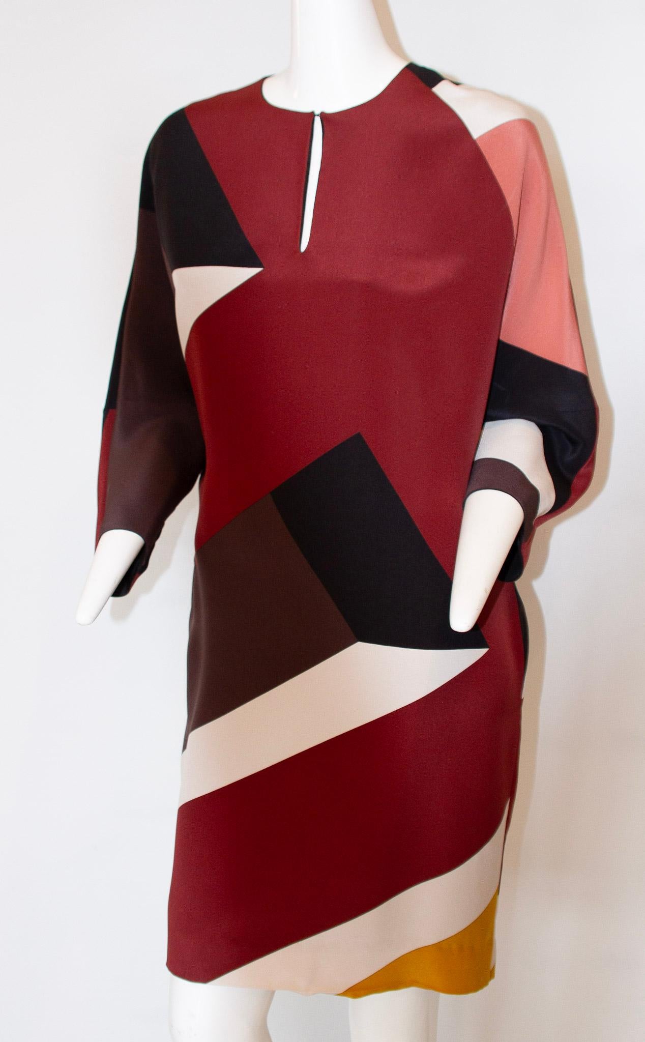 Fendi
Colorblock Two-Layer Silk 3/4 Dolman Sleeve Dress, Circa 2000

Hidden side pockets.
Round keyhole neckline.
Three-quarter dolman sleeves.
Above-the-knee hemline.
Sac dress.
Two-Layer, Silk lining. 