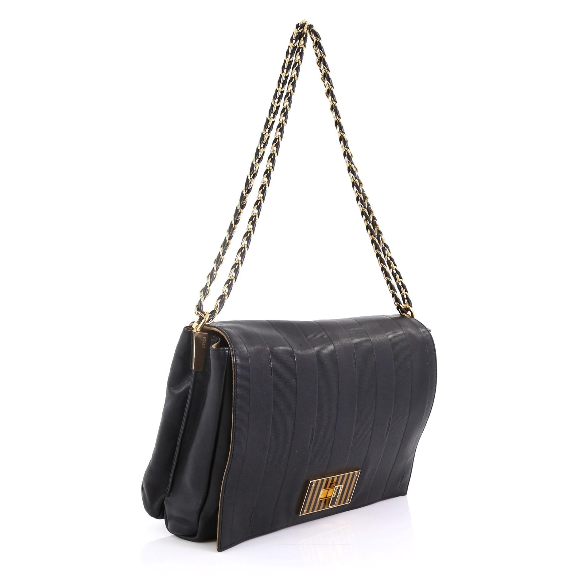 This Fendi Claudia Shoulder Bag Pequin Embossed Leather Large, crafted in black pequin embossed leather, features a woven-in lather chain strap, front flap with striped turn lock closure and gold-tone hardware. Its turn-lock closure opens to a beige