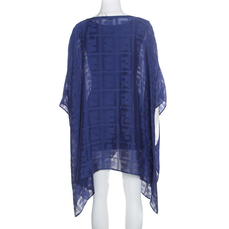 This lovely cover up kaftan from Fendi is sure to look fabulous on you! It is made of 100% silk in a lovely cobalt blue shade and features the brand logo design pattern all over it. Its asymmetrical silhouette looks amazing and it flaunts a boat
