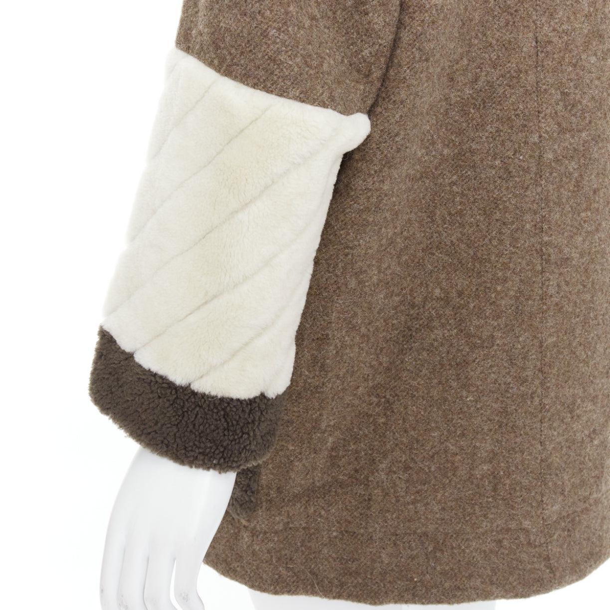 FENDI colorblocked brown wool patchwork fur hooded parka coat IT38 XS
Reference: NILI/A00077
Brand: Fendi
Material: Wool, Fur
Color: Brown, White
Pattern: Solid
Closure: Zip
Lining: Brown Fabric
Extra Details: Fendi beige wool parka coat with fox
