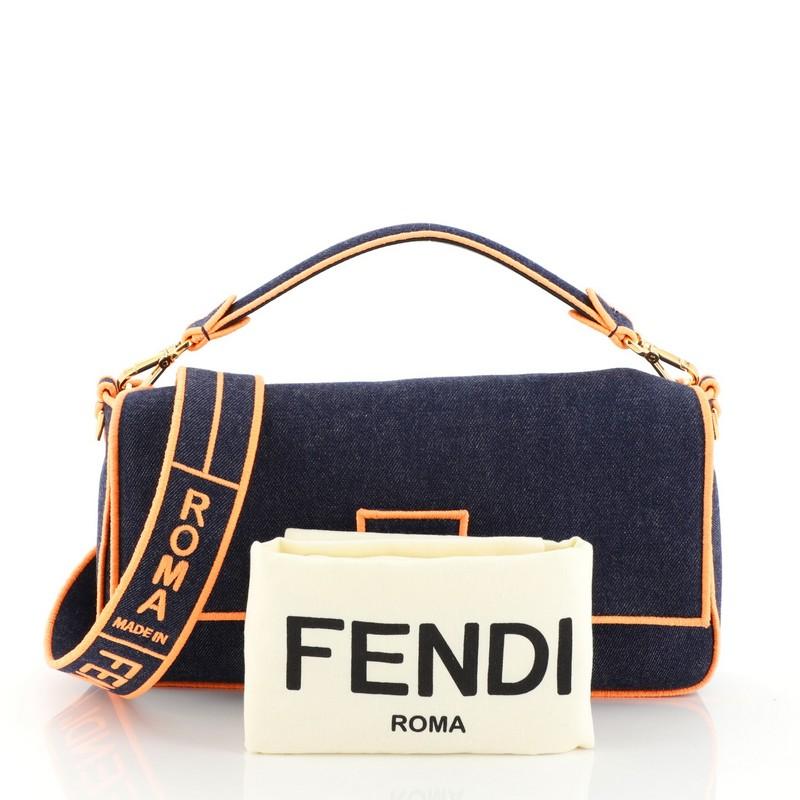 This Fendi Convertible Baguette Crossbody Denim, crafted in blue denim, features detachable shoulder leather strap, frontal flap and gold-tone hardware. Its magnetic snap closure opens to a blue denim interior with side zip pocket. 

Estimated